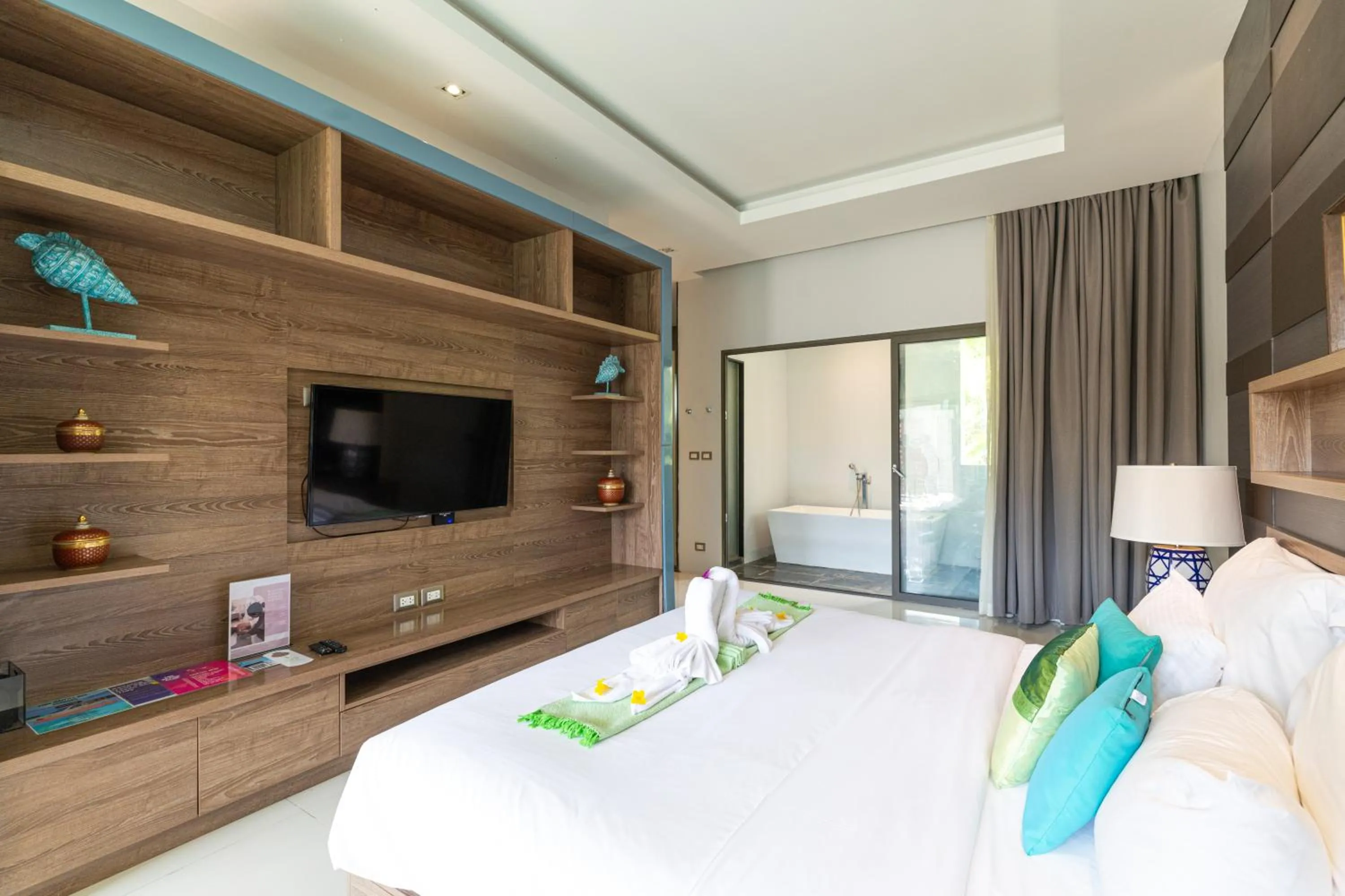 Communal lounge/ TV room, Bed in Phuket Moonlit Bay Seaview Resort & Spa