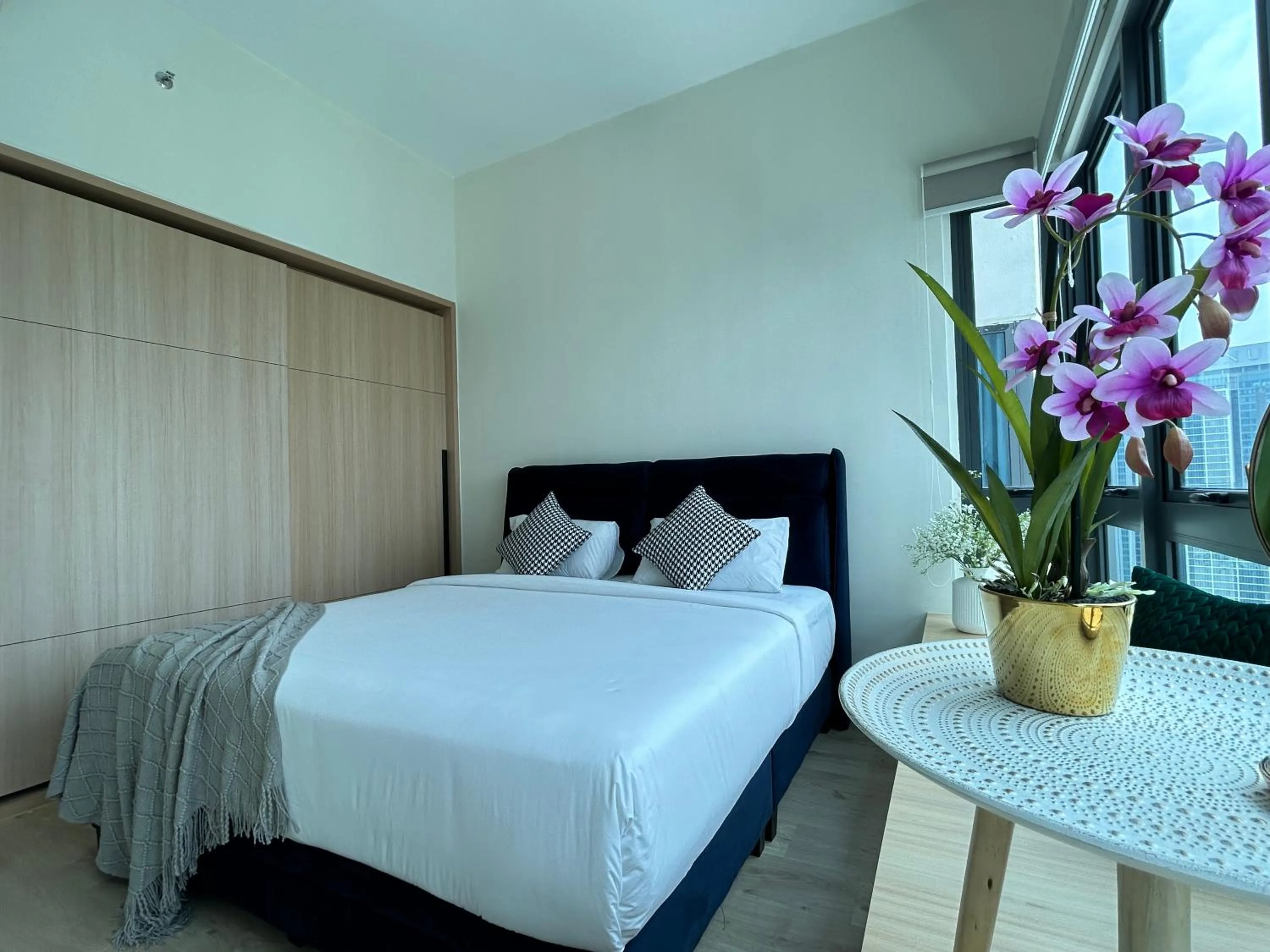 Bed in The Luxe by Infinitum Suites