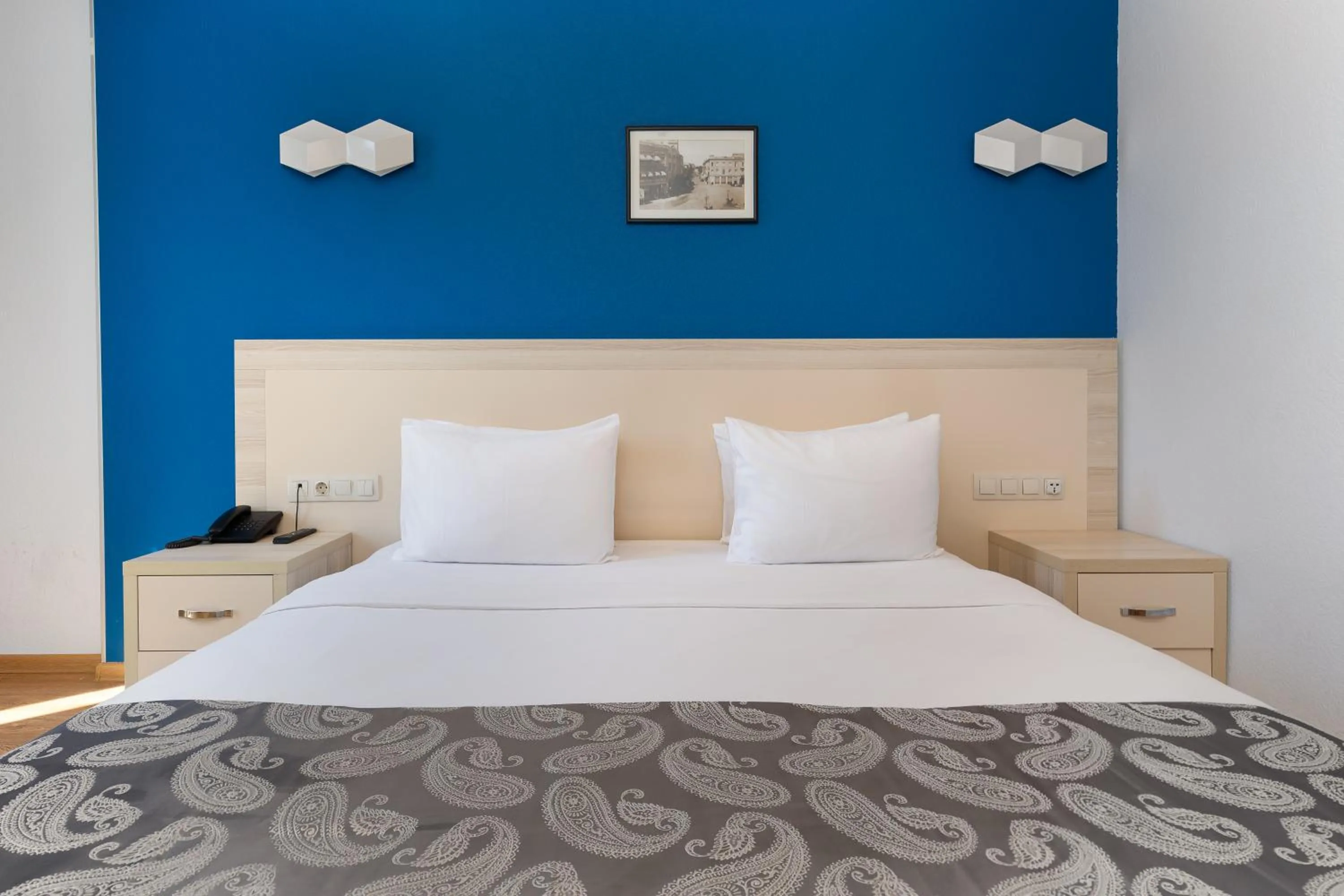 Bed in Iveria Inn Hotel