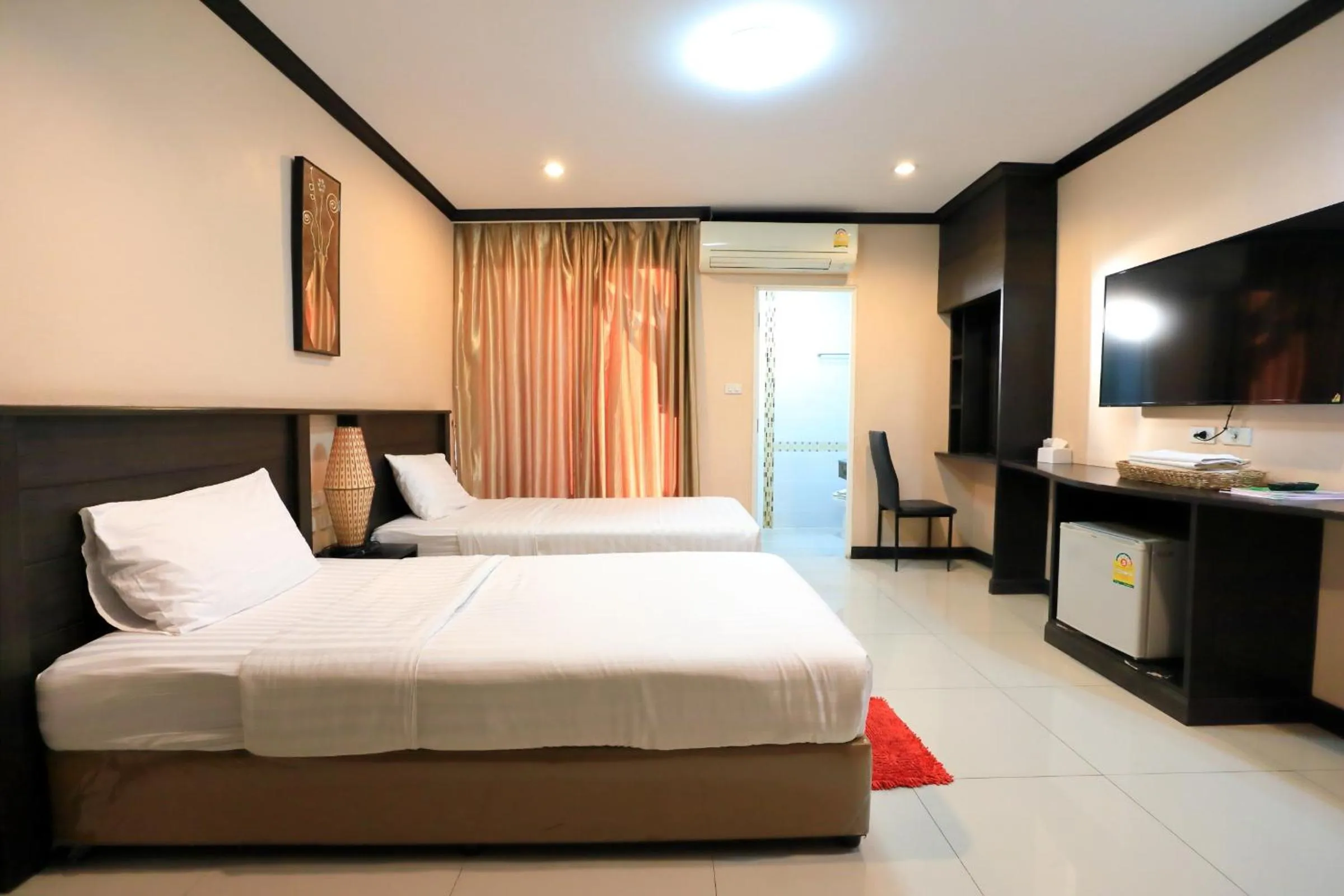 Bed in Triton Hotel Nakhonratchasima โรงแรมไททัน