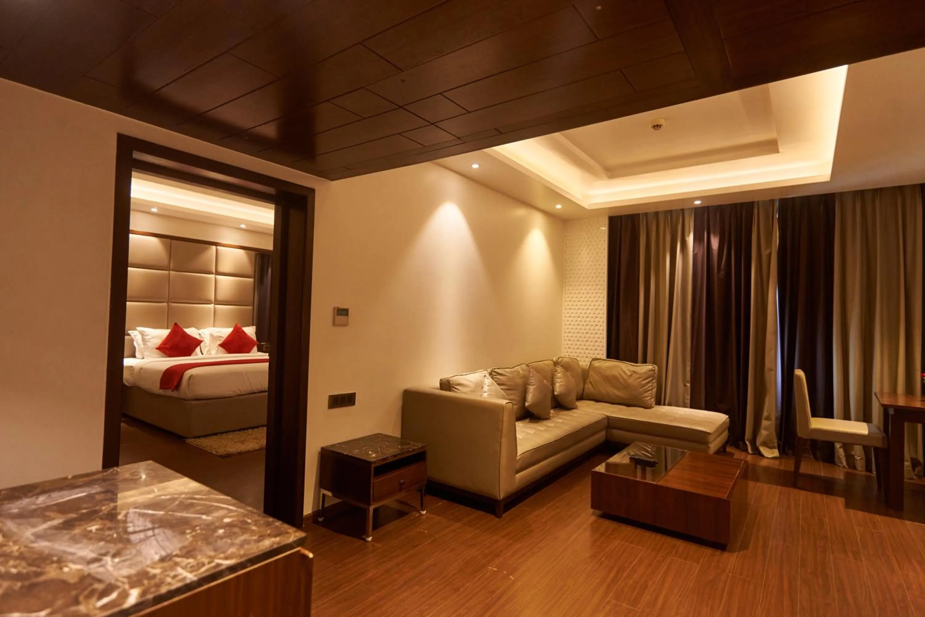 Living room, Bed in Tania President Inn