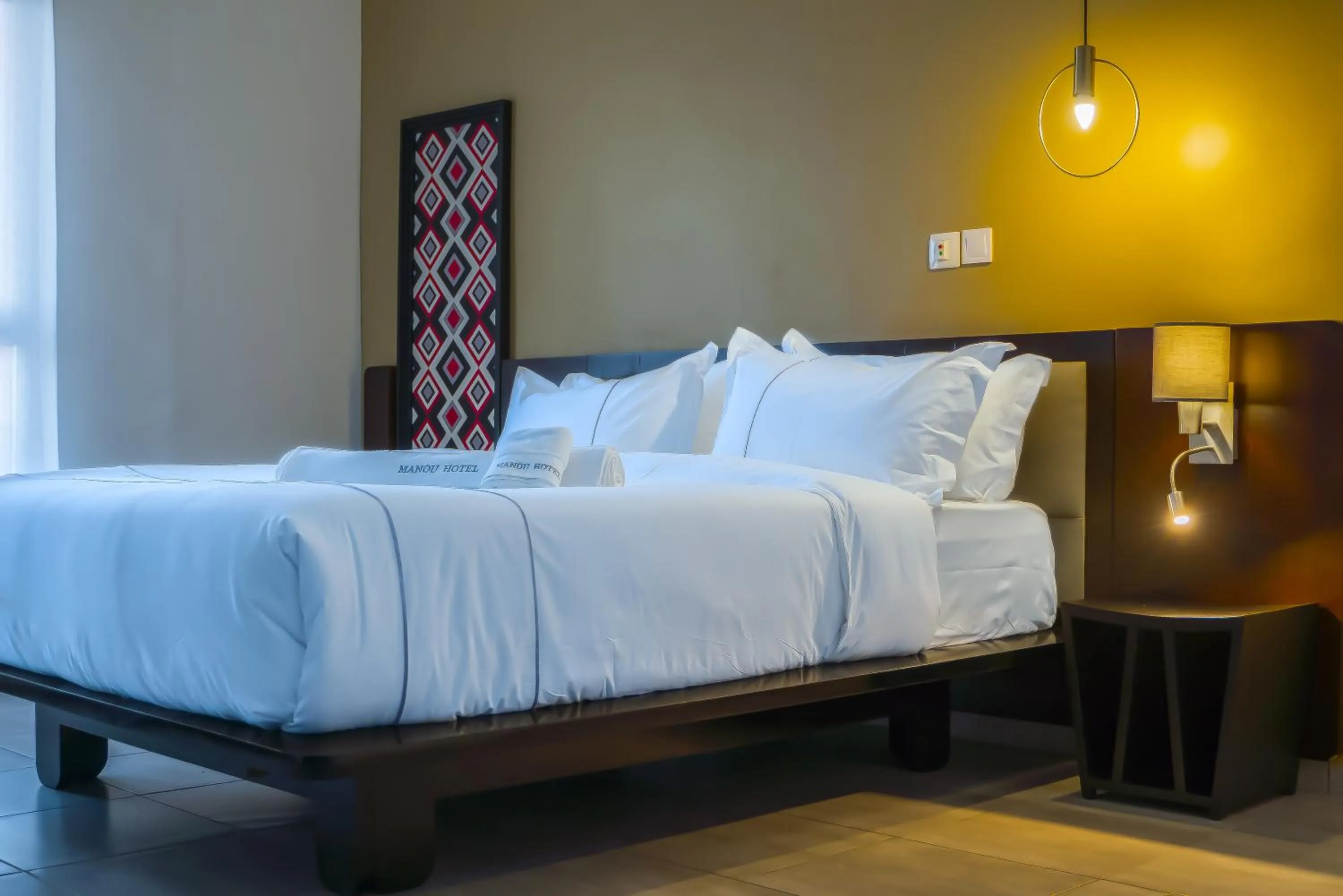 Bed in MANOU HOTEL