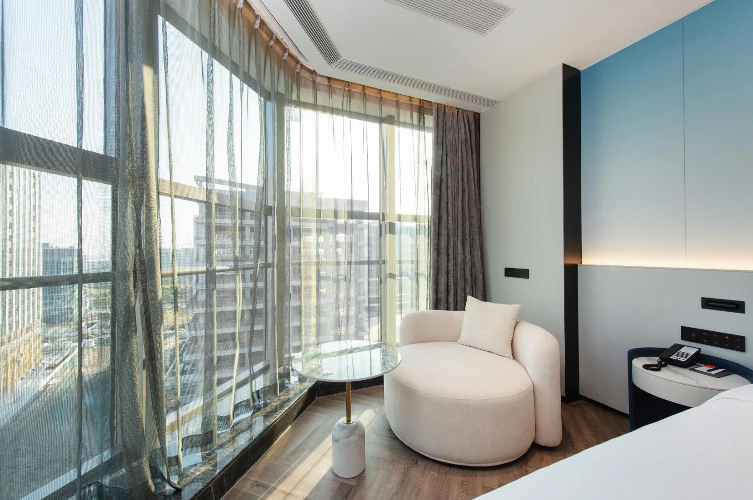 Living room, Bed in Novotel Shanghai Lingang