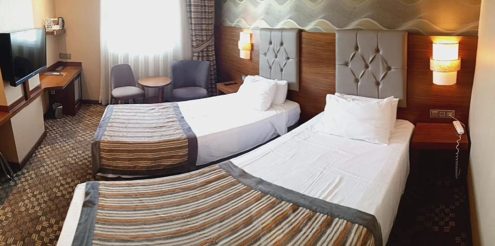 Bed in Adranos Hotel