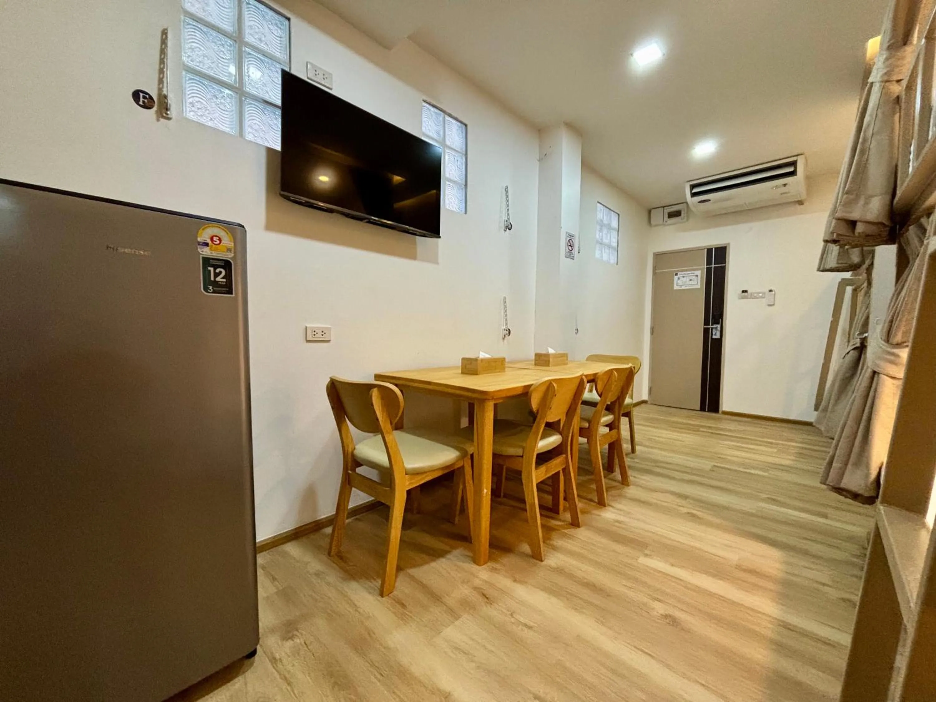 Seating area in Charm Hostel at Pratumnak