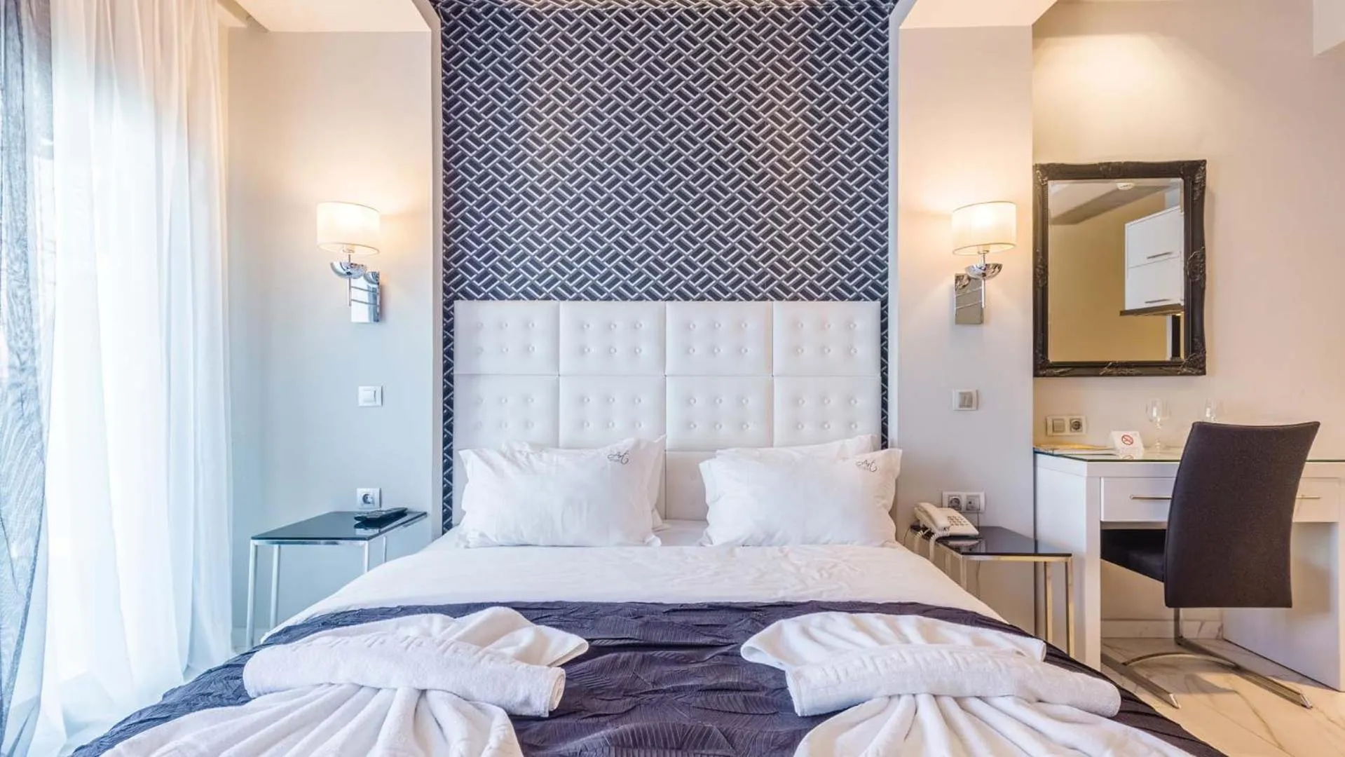 Bed in Alpha Luxury Suites