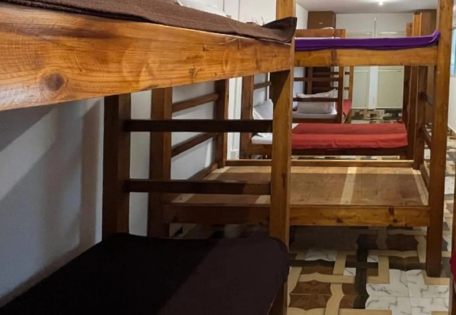 Bed in La Paulo's Back to Basic Beach Resort