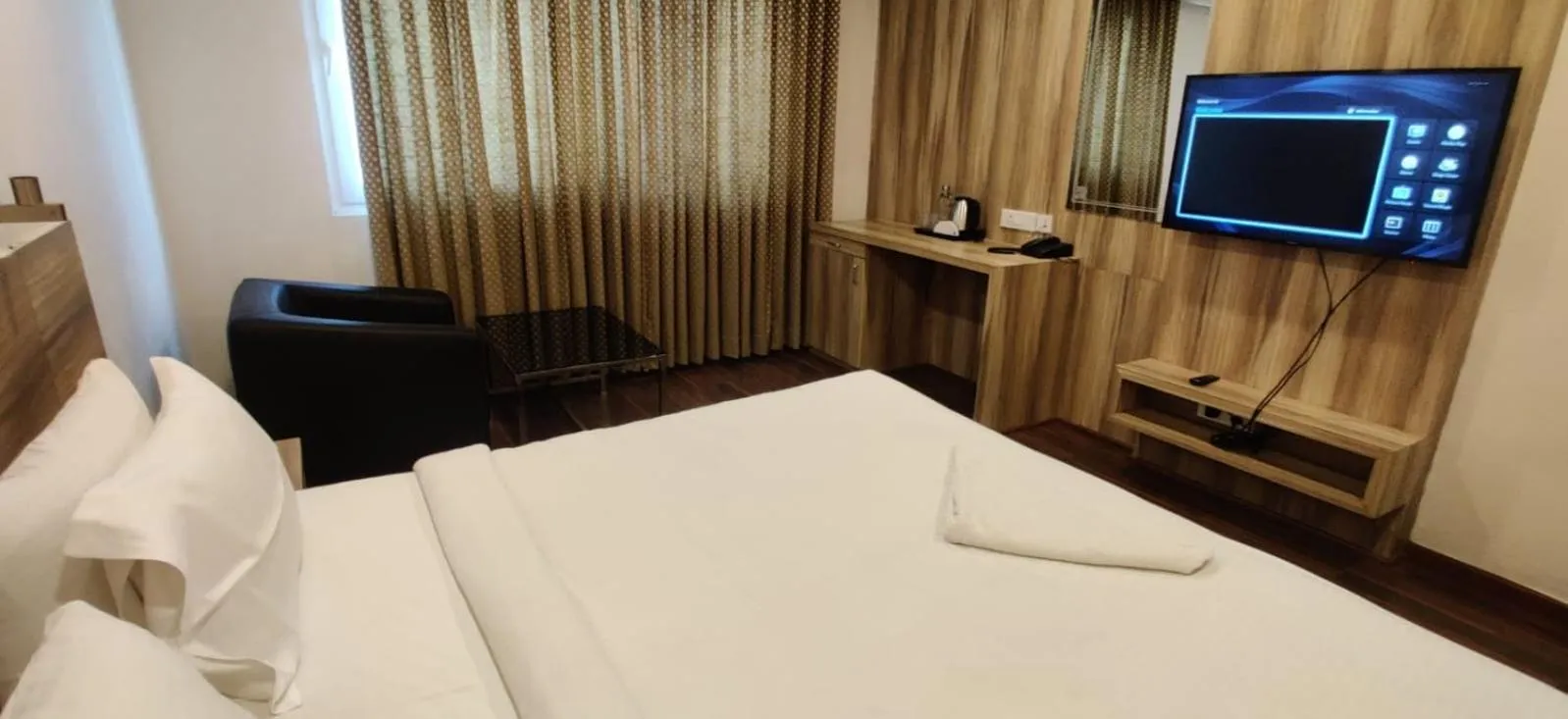 Bed in Hotel RN Grand