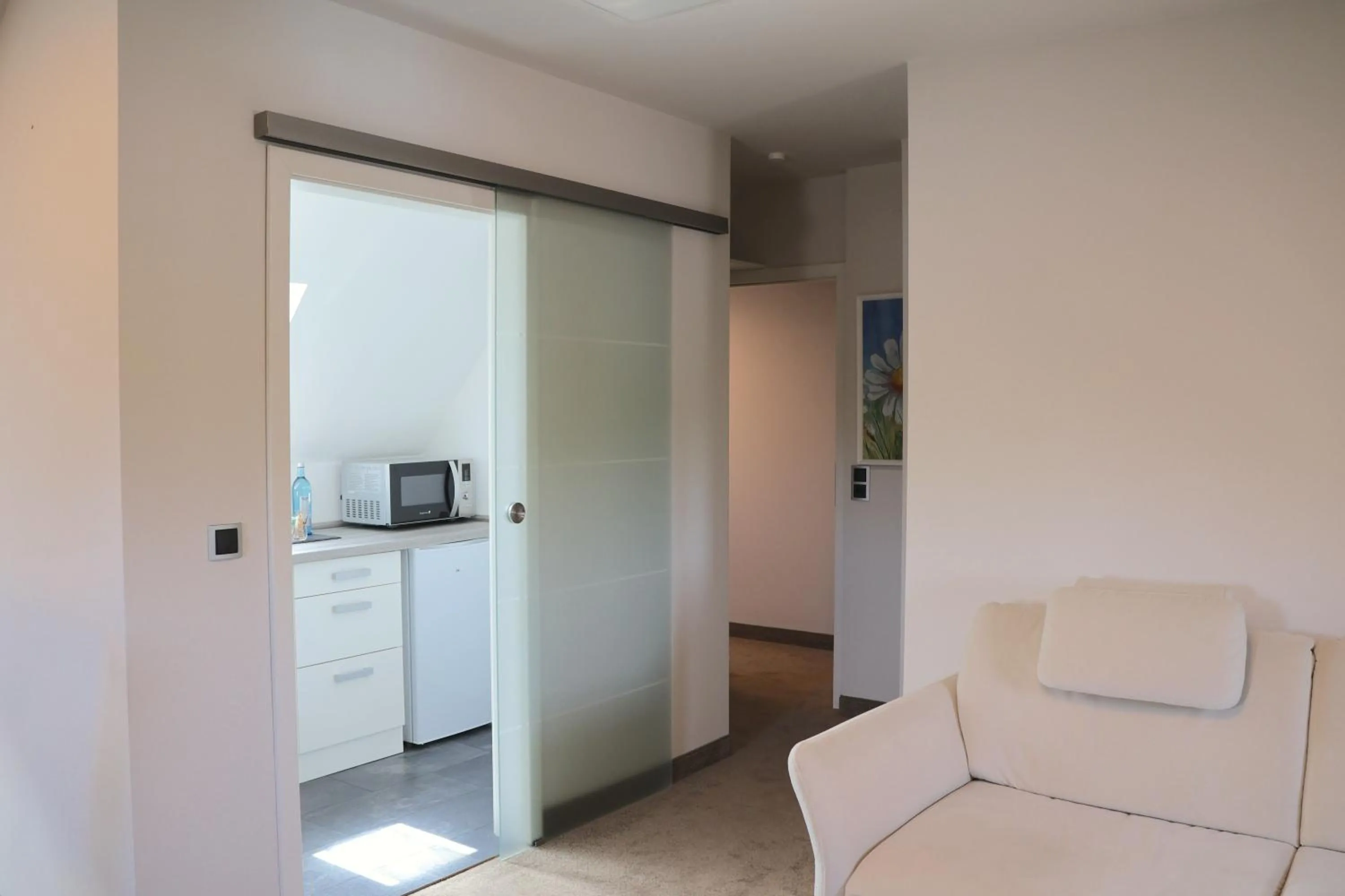 Kitchen or kitchenette, Bed in Hotel an der Therme