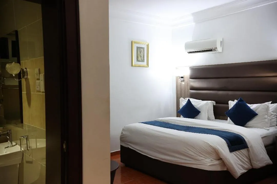 Bed in Bolton White Residence