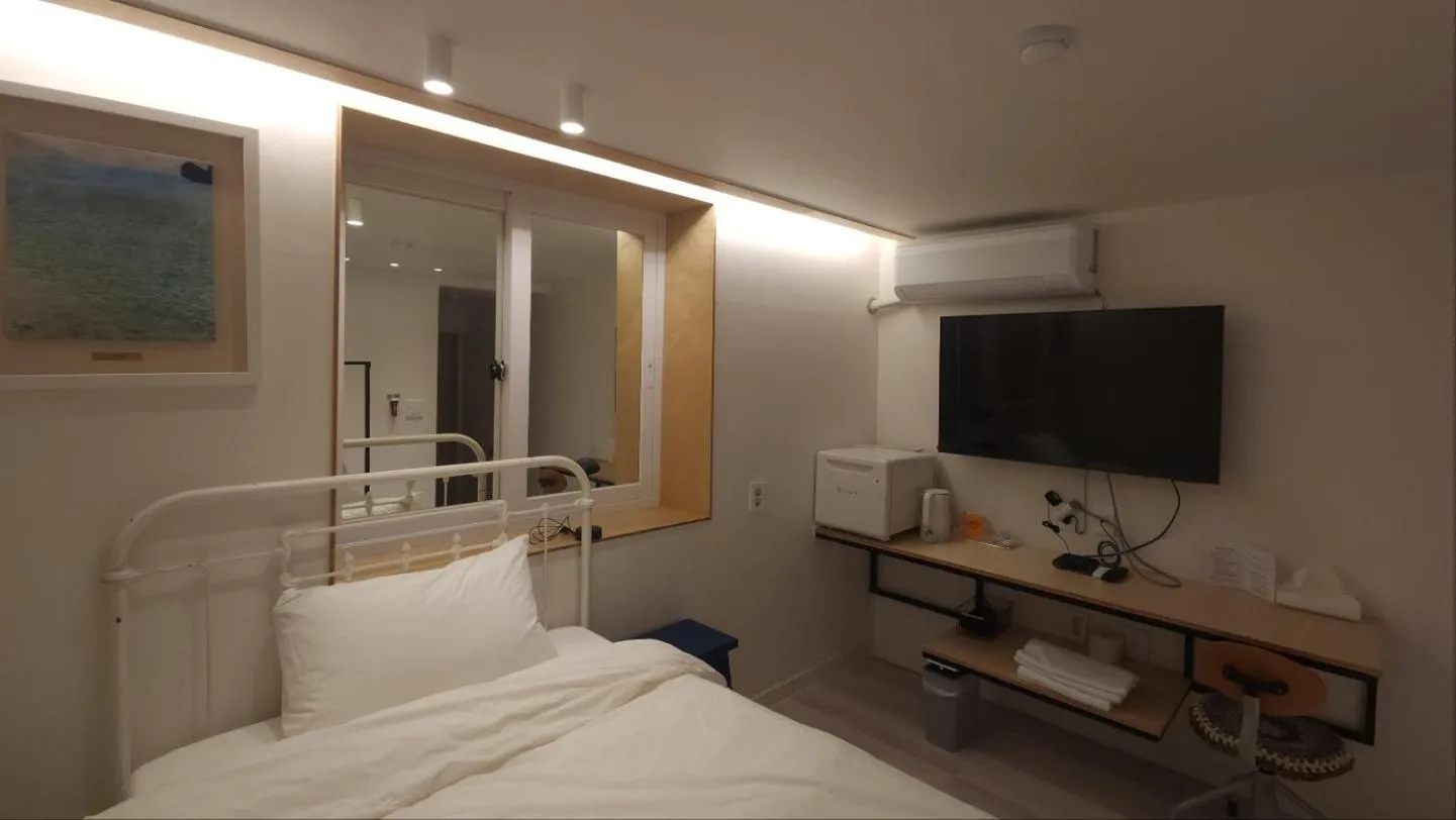 Bed in World House Hotel