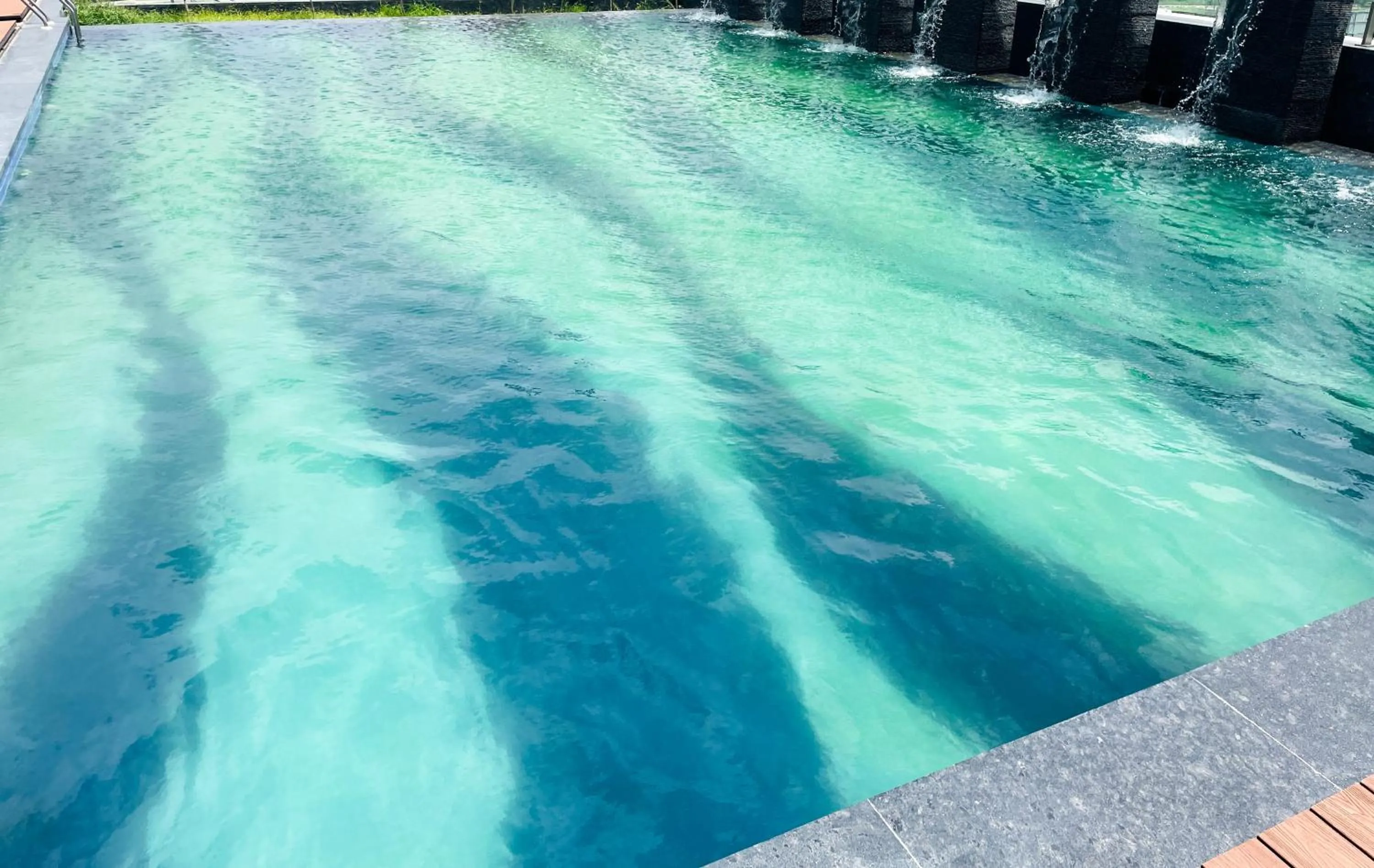 Swimming pool in Ramada Encore by Wyndham Gurugram Dwarka Expressway