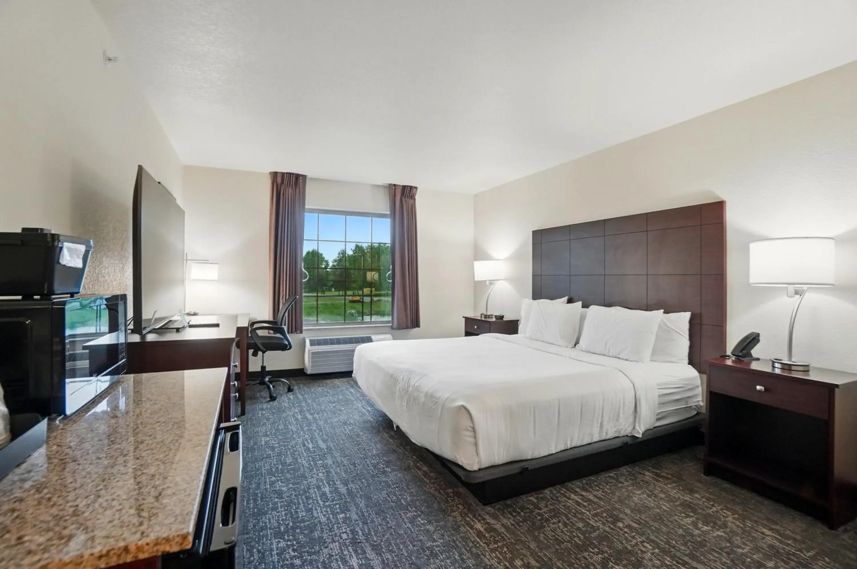 King Room with Roll-In Shower - Disability Access in Cobblestone Hotel & Suites - Eaton King Room with Roll-In Shower - Disability Access in Cobblestone Hotel & Suites - Eaton