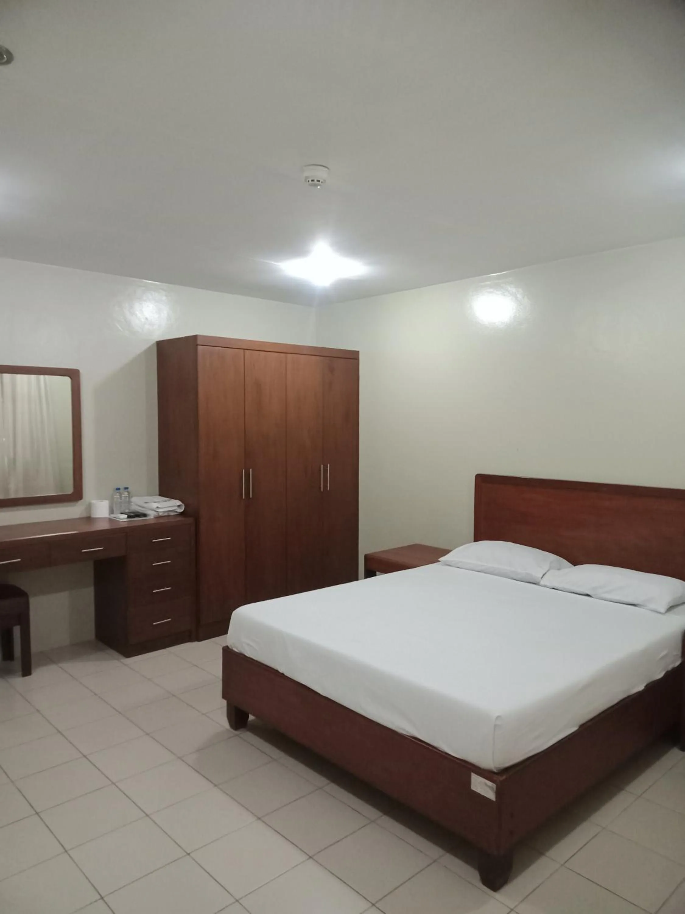 Bed in Joyce Apartelle San Juan