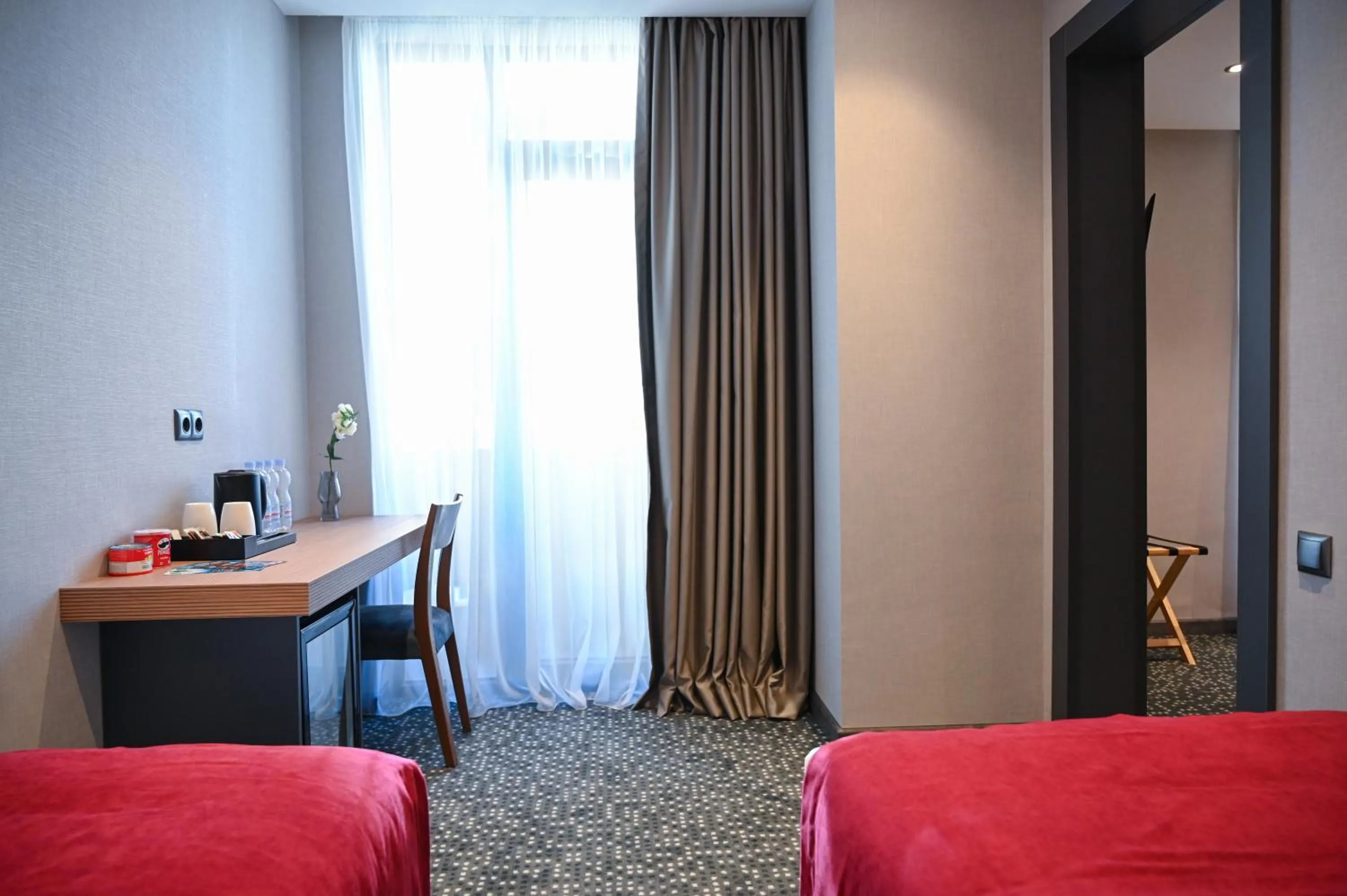 Seating area, Bed in Landmark Hotel