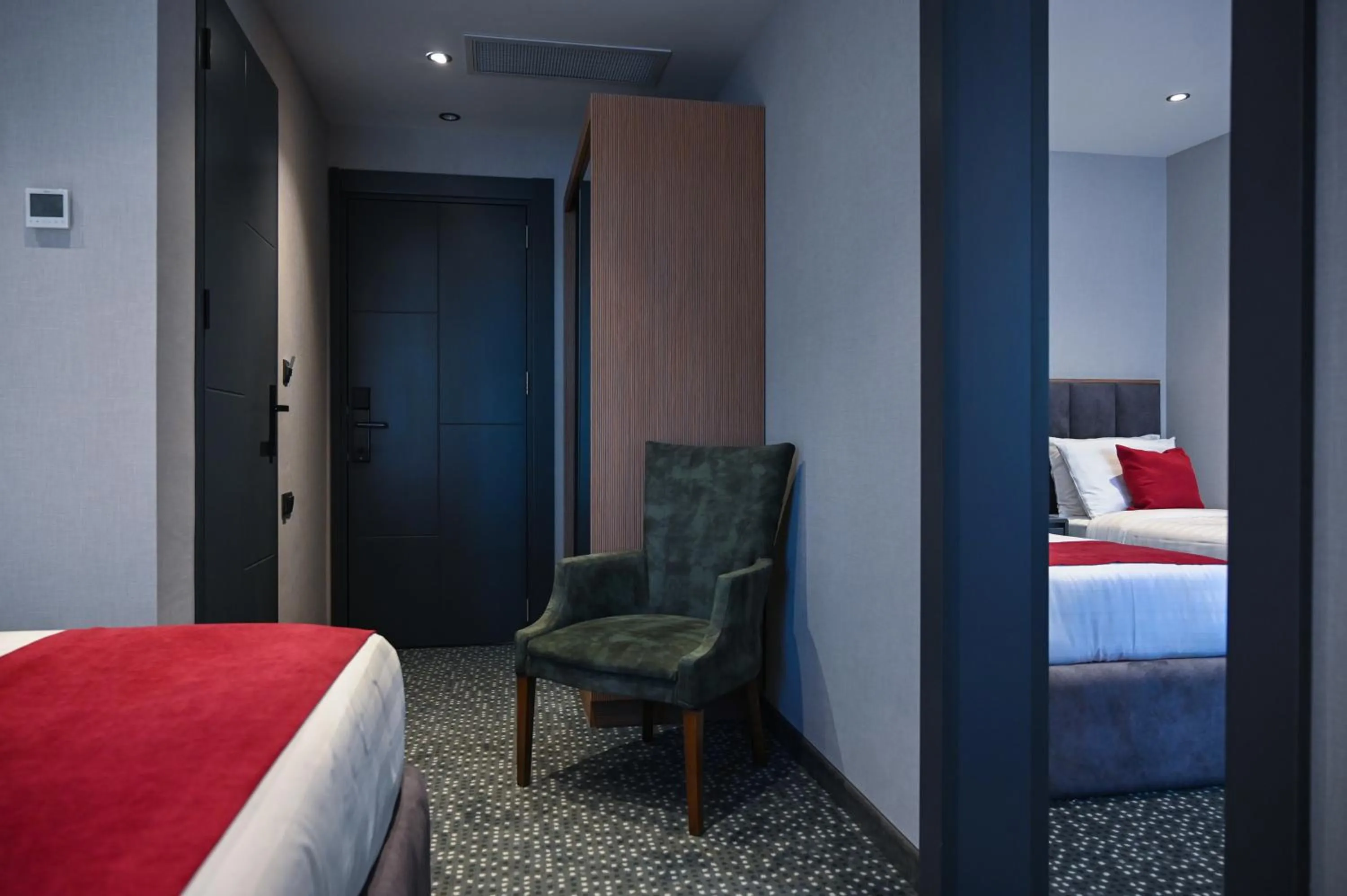 Seating area, Bed in Landmark Hotel