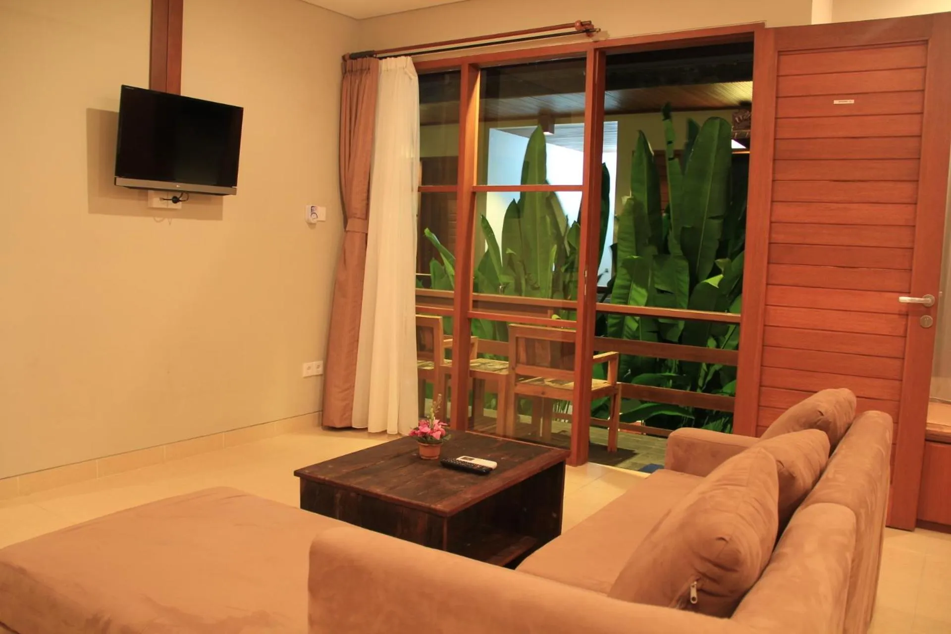 Communal lounge/ TV room in Semarandana Bedrooms and Pool