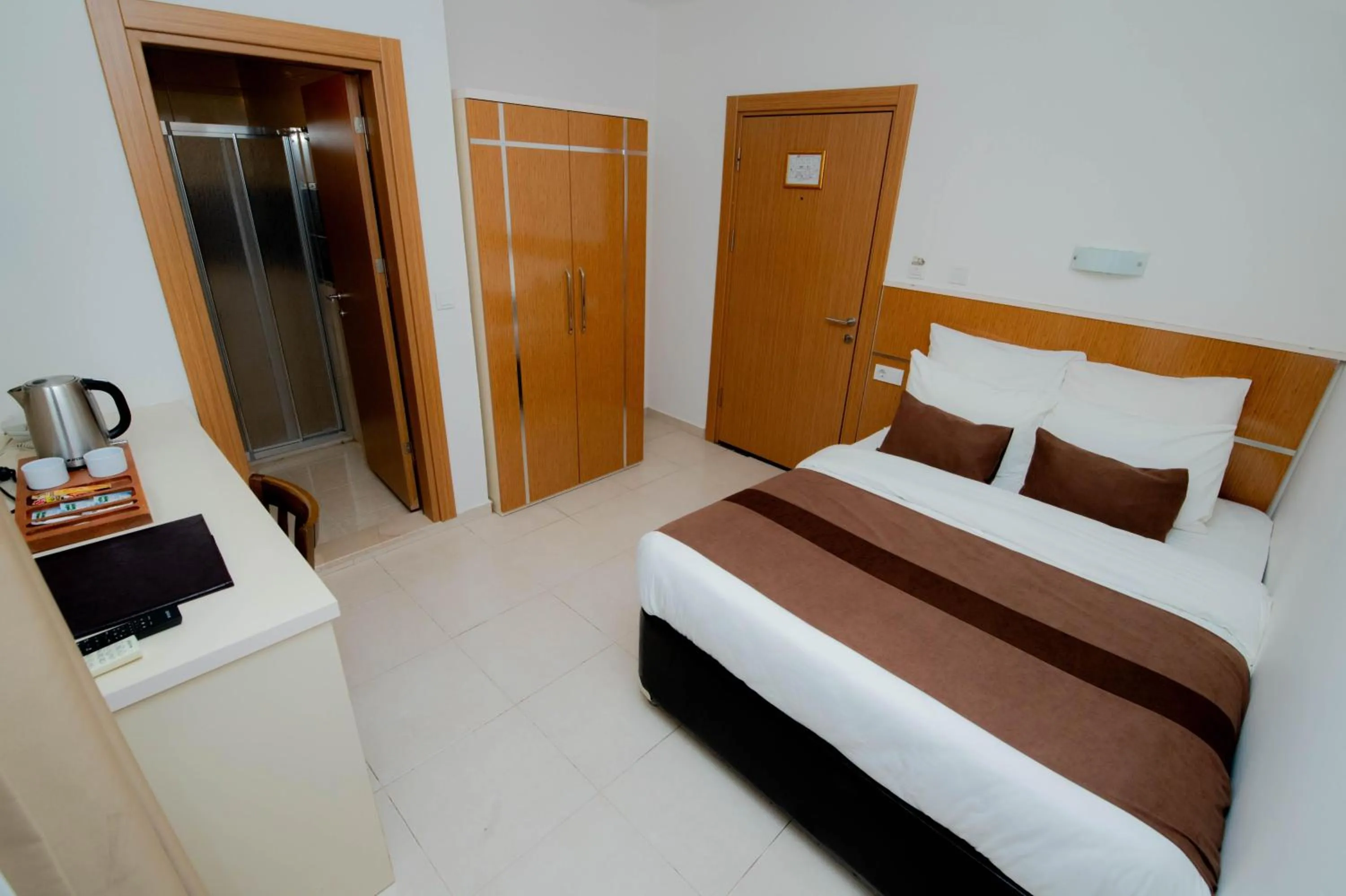 Bed in Palm Beach Hotel