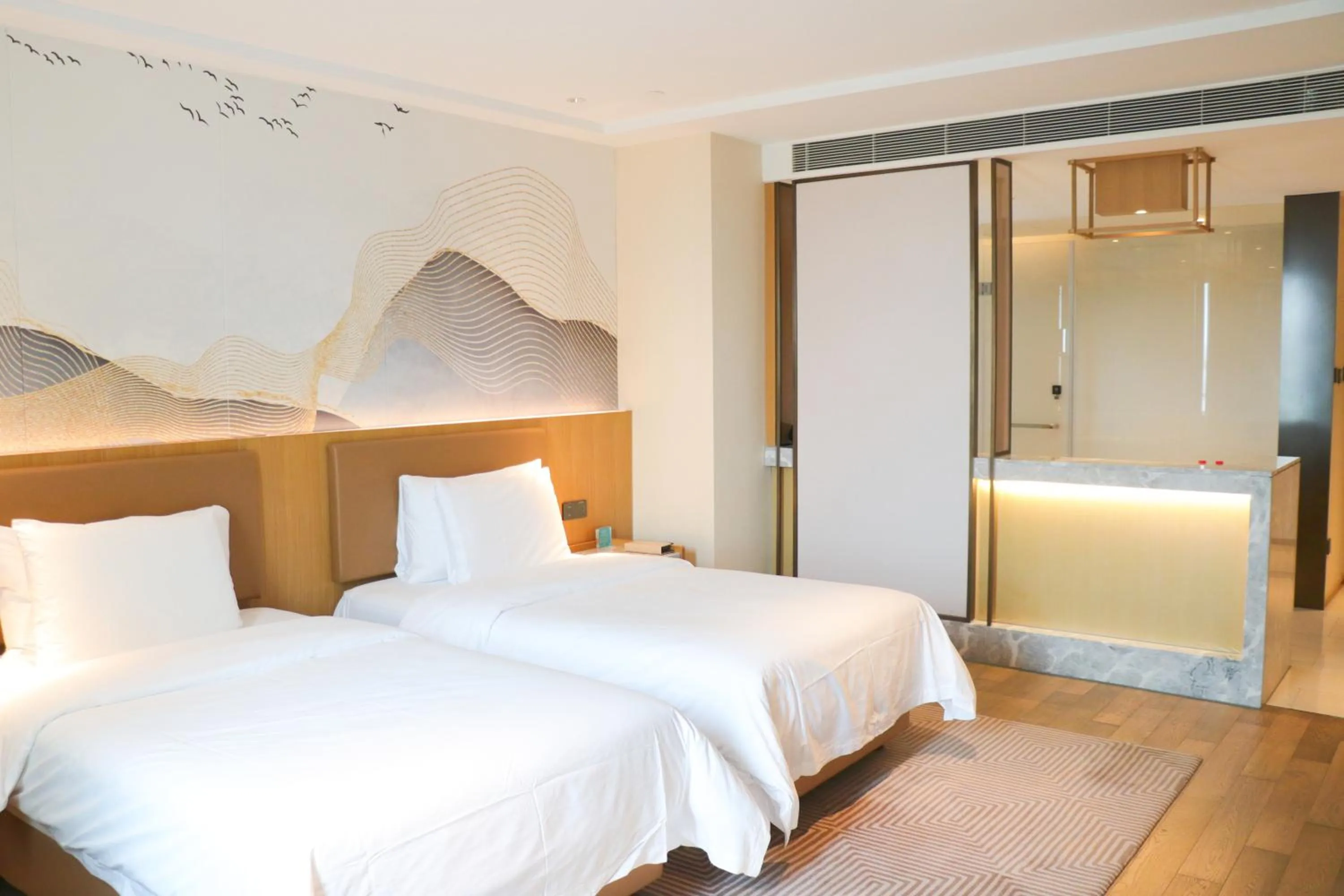 Bed in New Century Grand Hotel Changxing