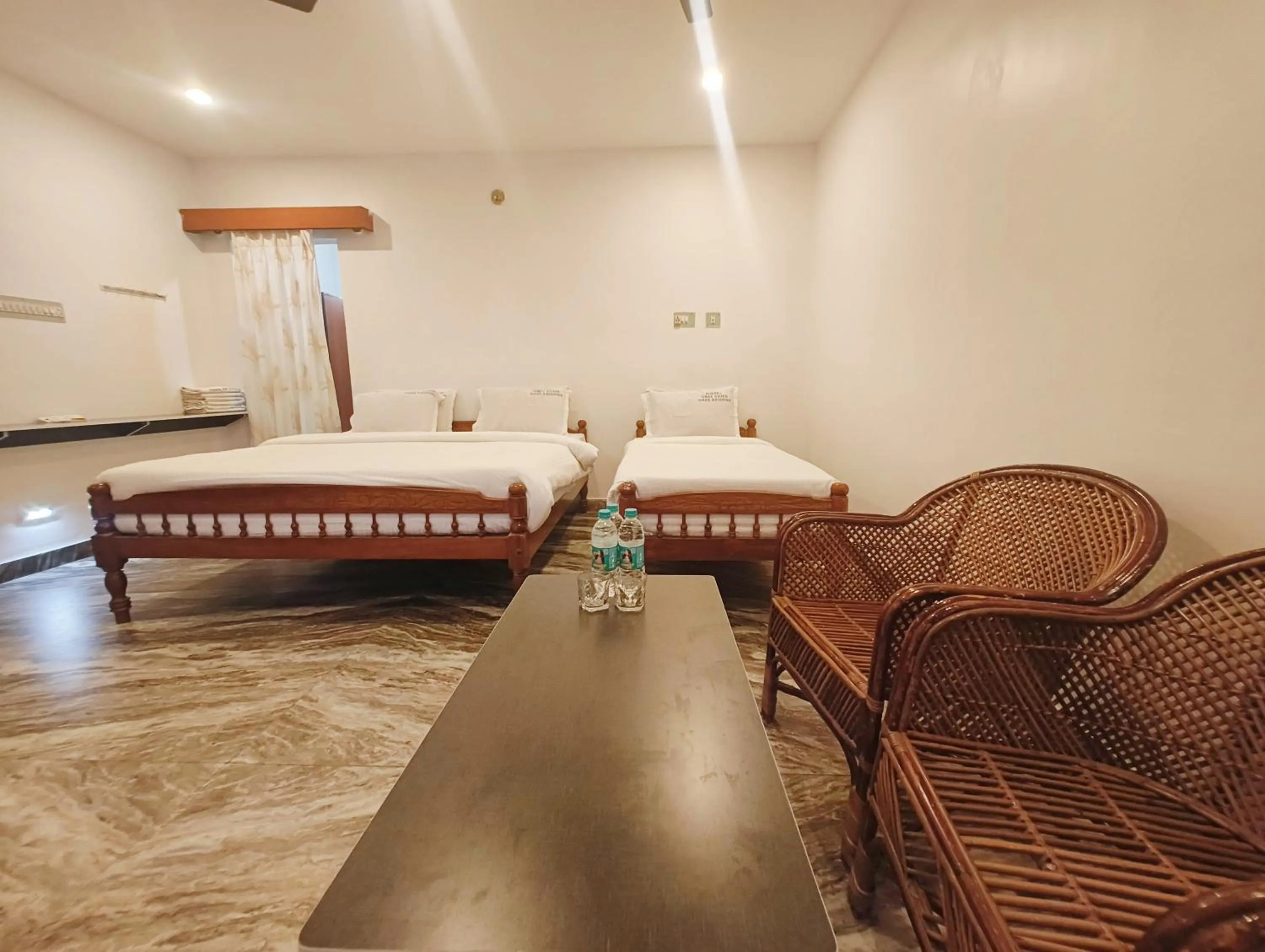 Seating area, Bed in Hare Rama Hare Krishna - EESHA Hotel