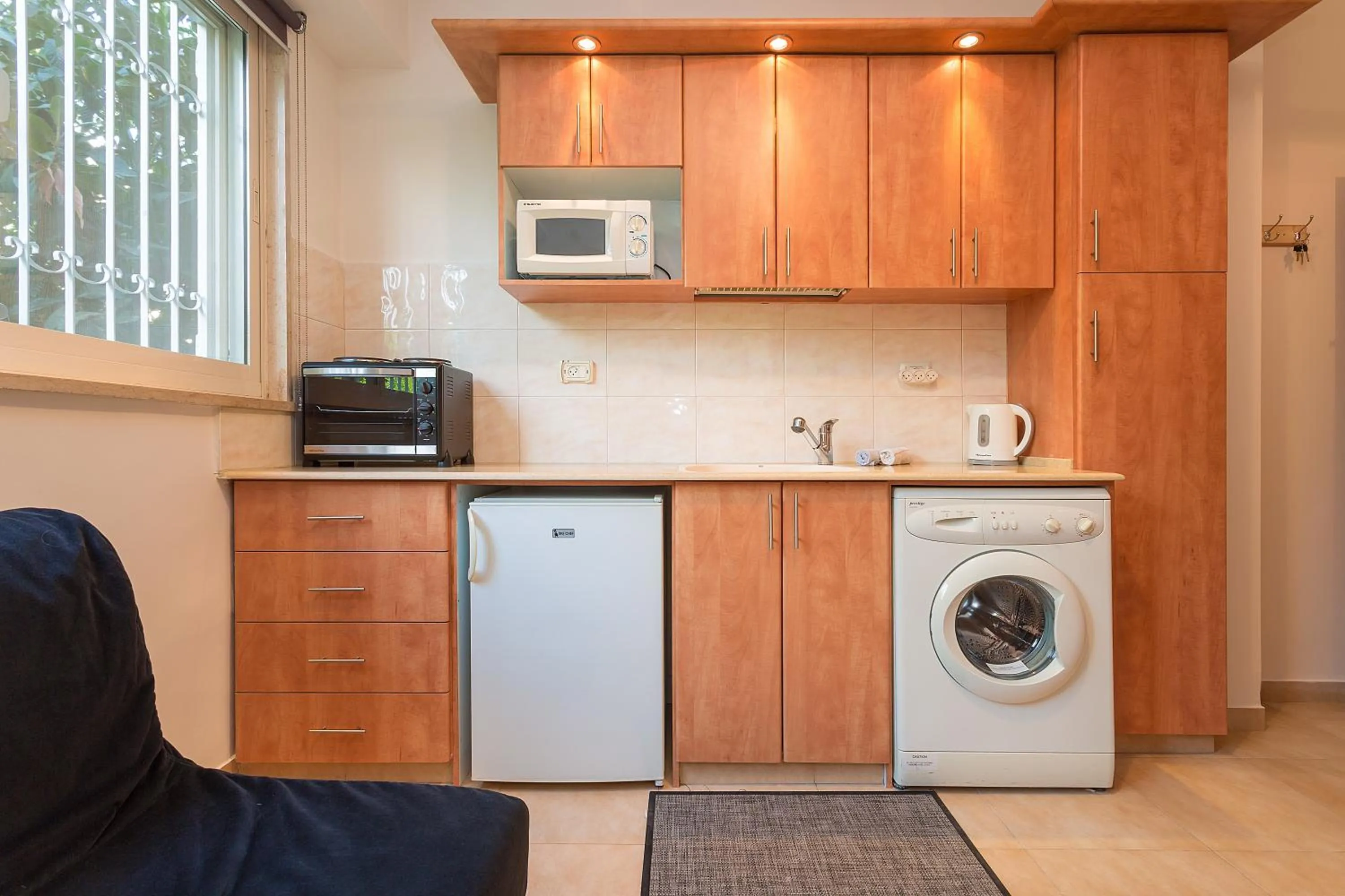 Kitchen or kitchenette in Colony Suites- Hananya St.