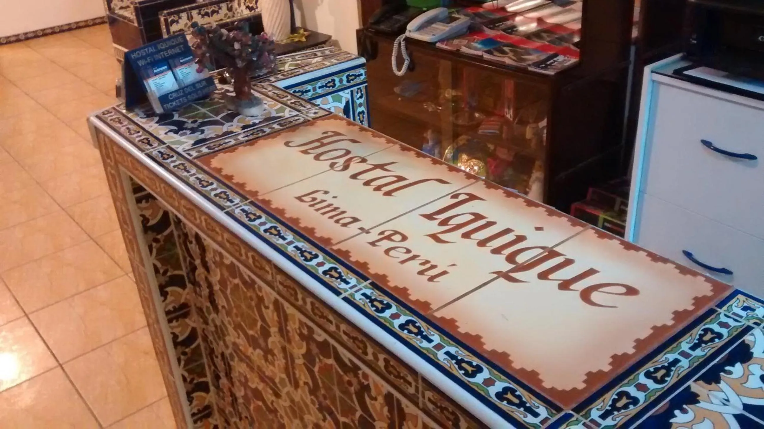 Property logo or sign in Hostal Iquique