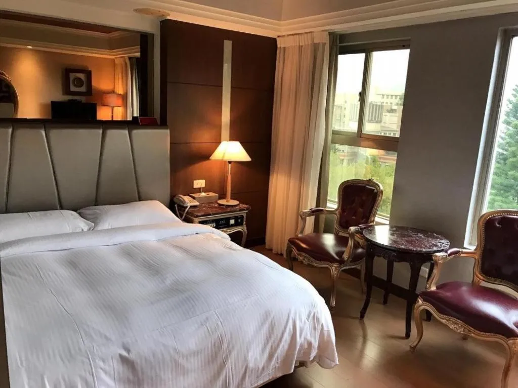 Bed in JBG Hotspring Resort Hotel