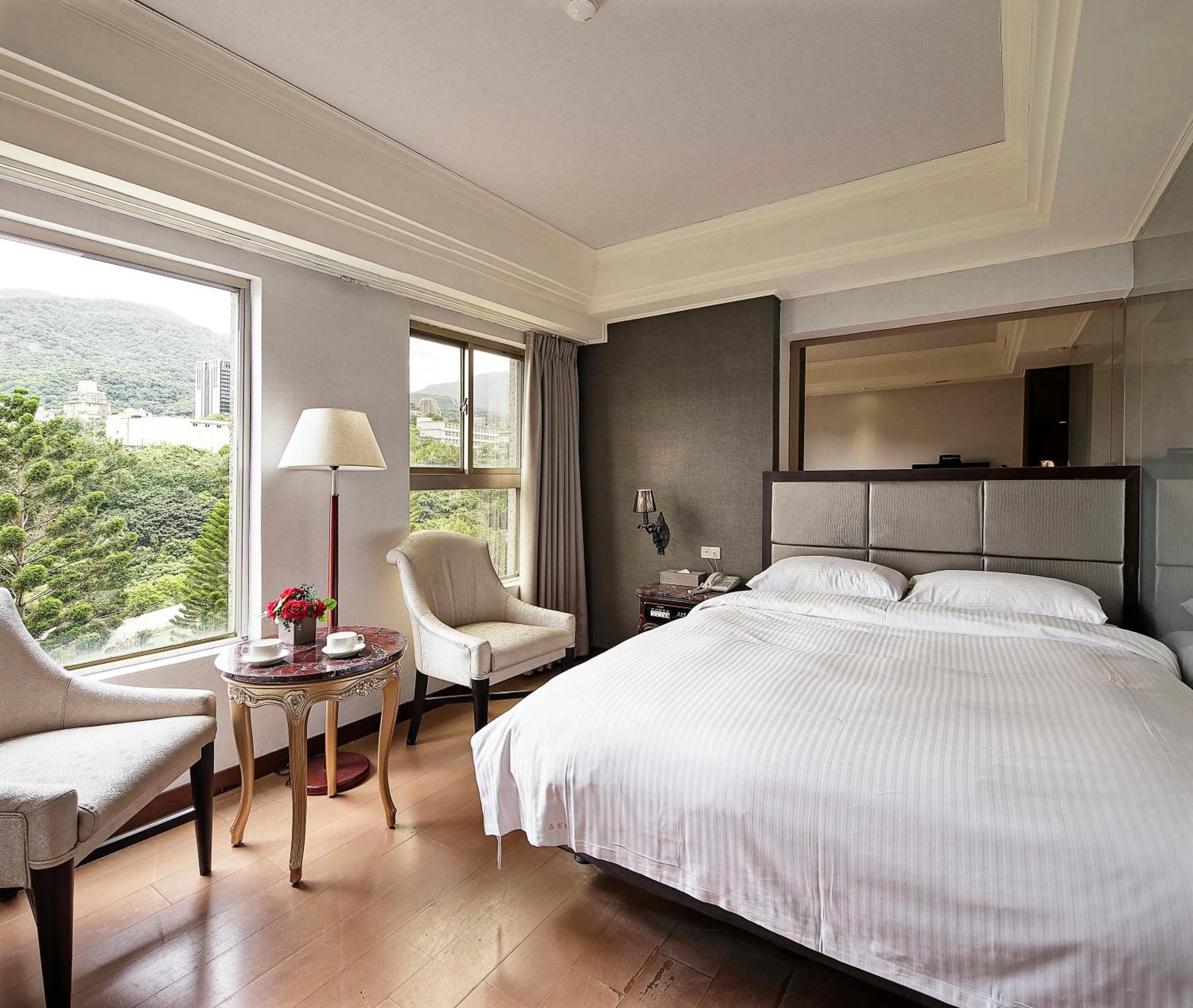 Bed in JBG Hotspring Resort Hotel