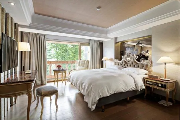 Bed in JBG Hotspring Resort Hotel