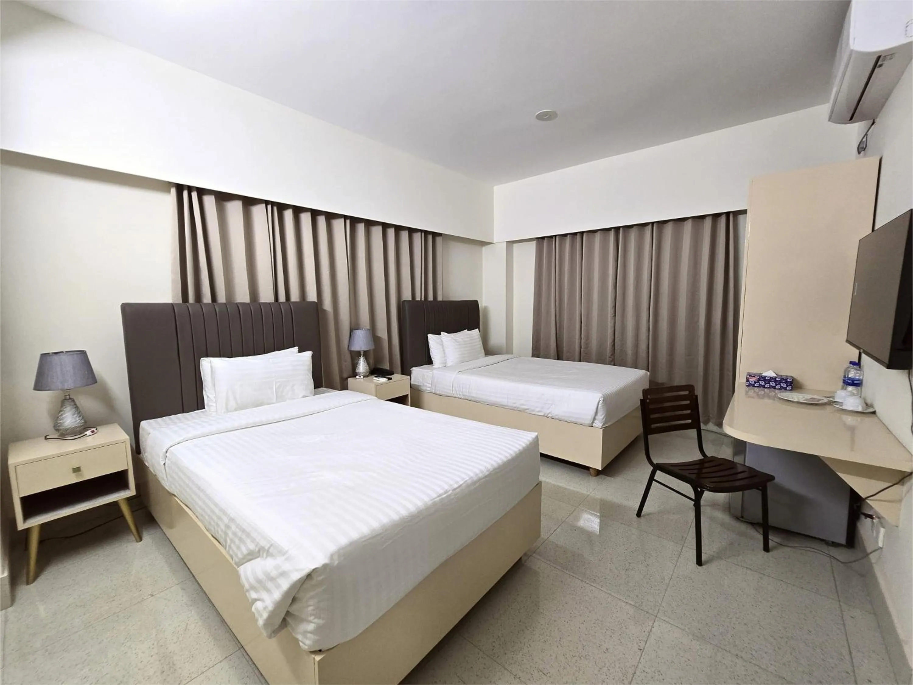 Photo of the whole room, Bed in Royal Regent Suites Dhaka