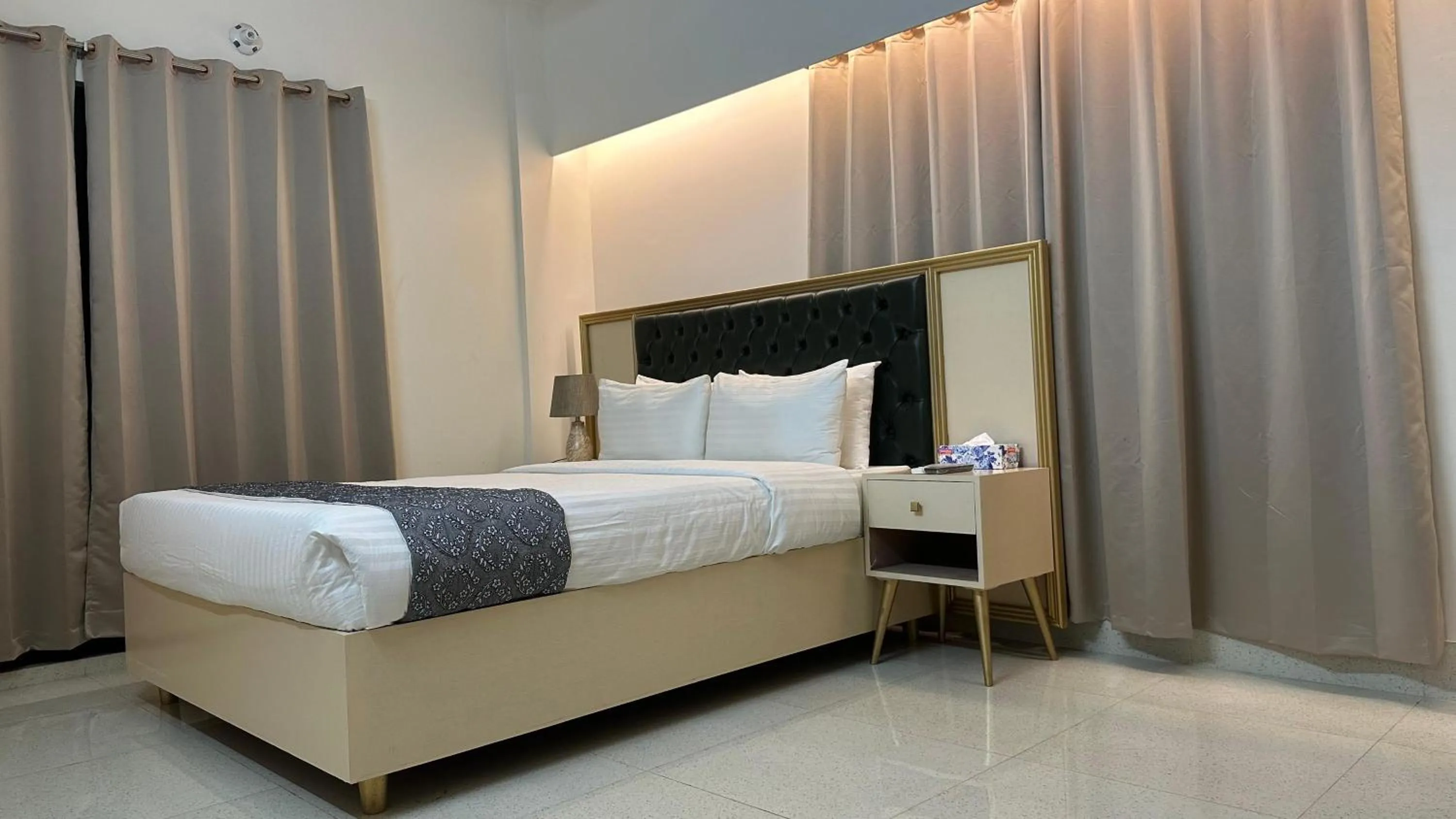 Bed in Royal Regent Suites Dhaka