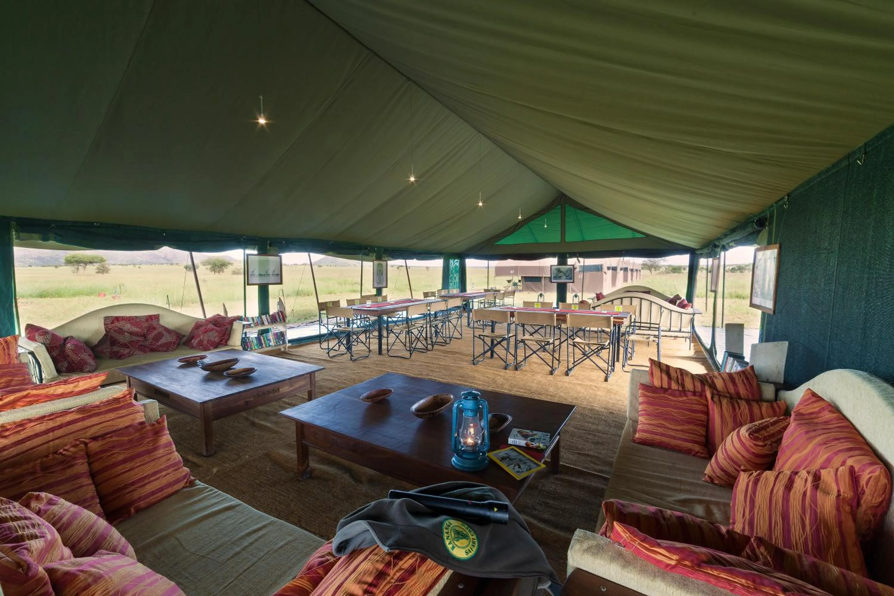 Communal lounge/ TV room in Kananga Special Tented Camp
