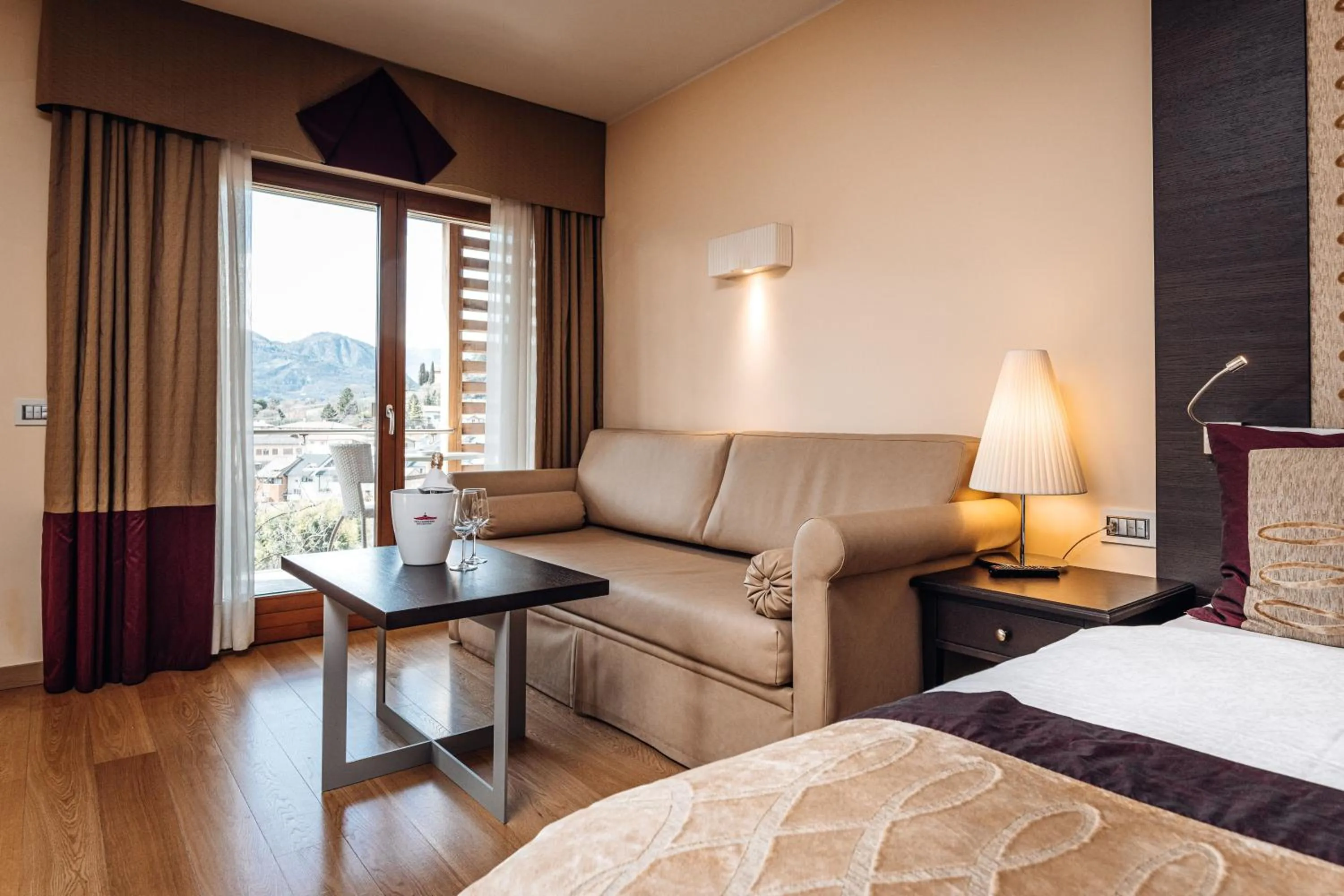 Living room, Bed in Hotel Villa Madruzzo