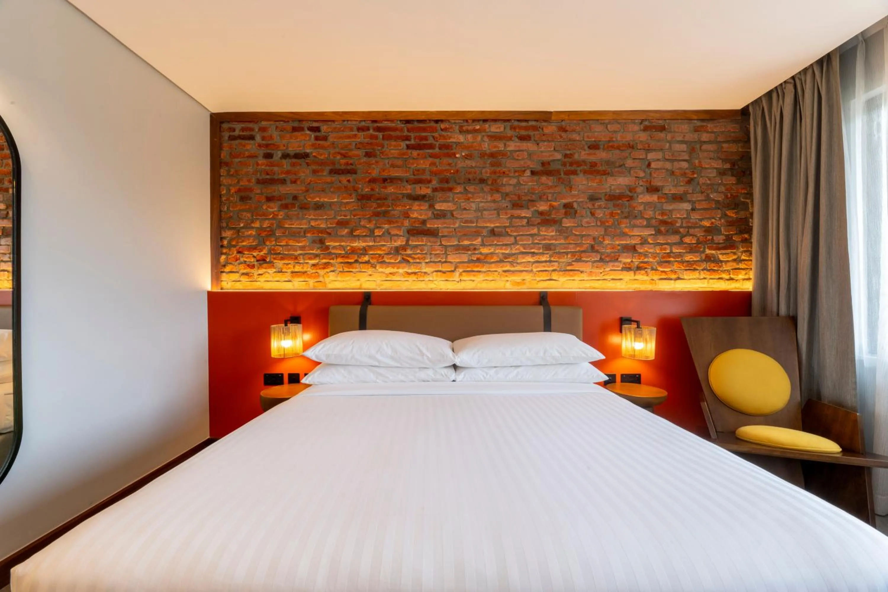 Bed in Zaria Court Kigali, Tapestry Collection by Hilton