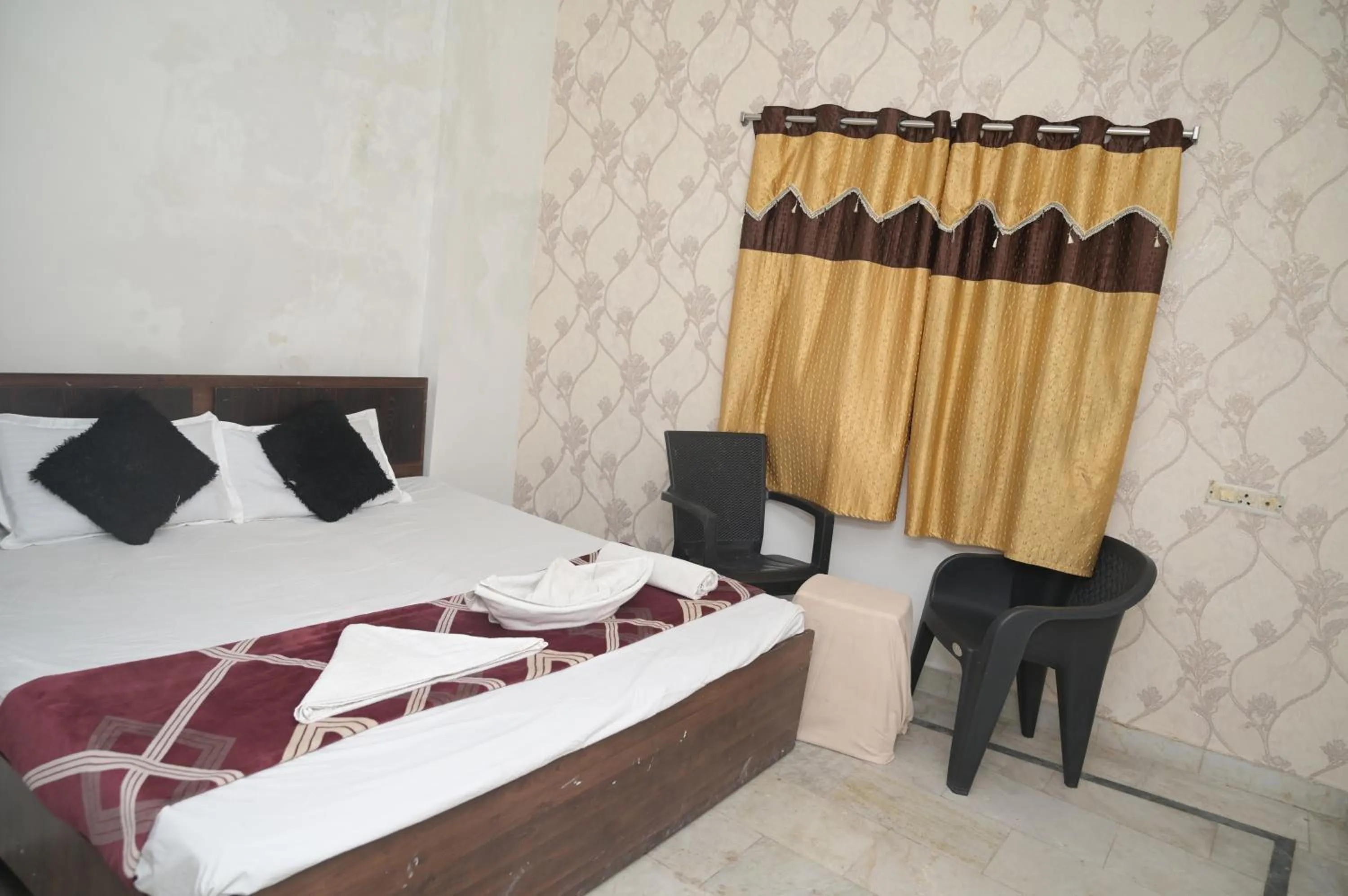 Bed in Rk hotel Rooms