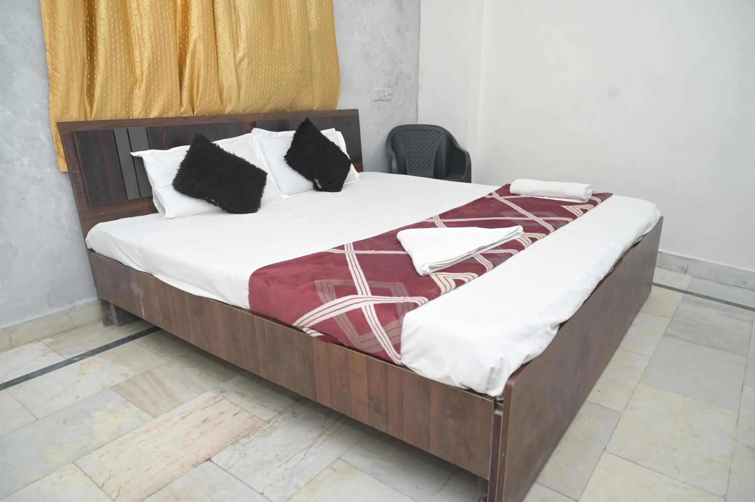 Bed in Rk hotel Rooms