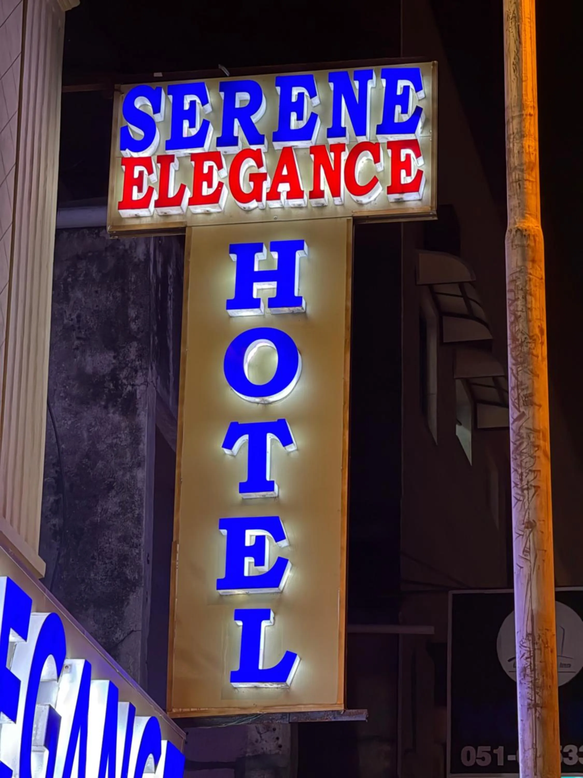 Property logo or sign in Serene Elegance Hotel