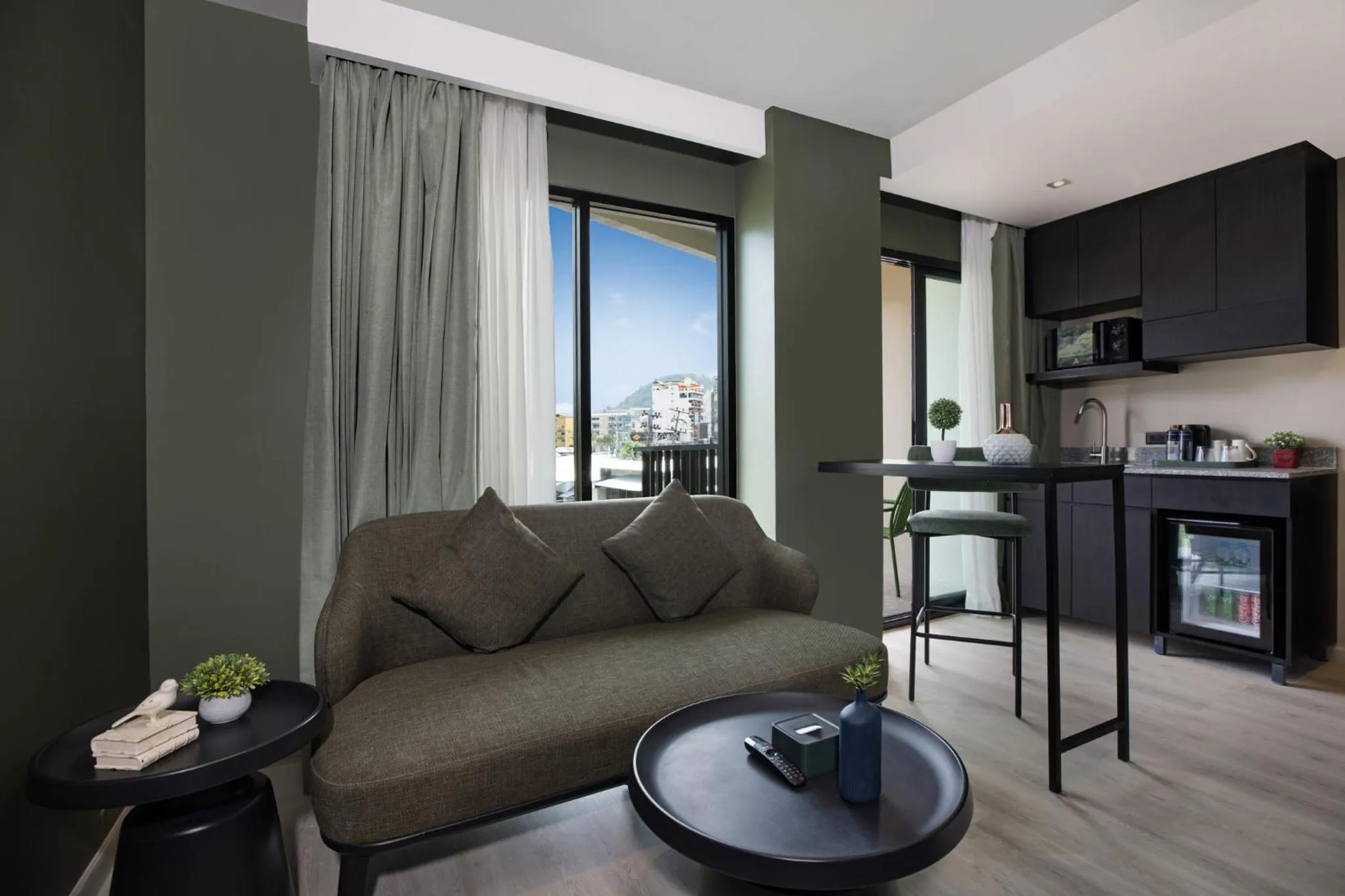 Seating area in Syama Mansion Patong, an Aspira Collection