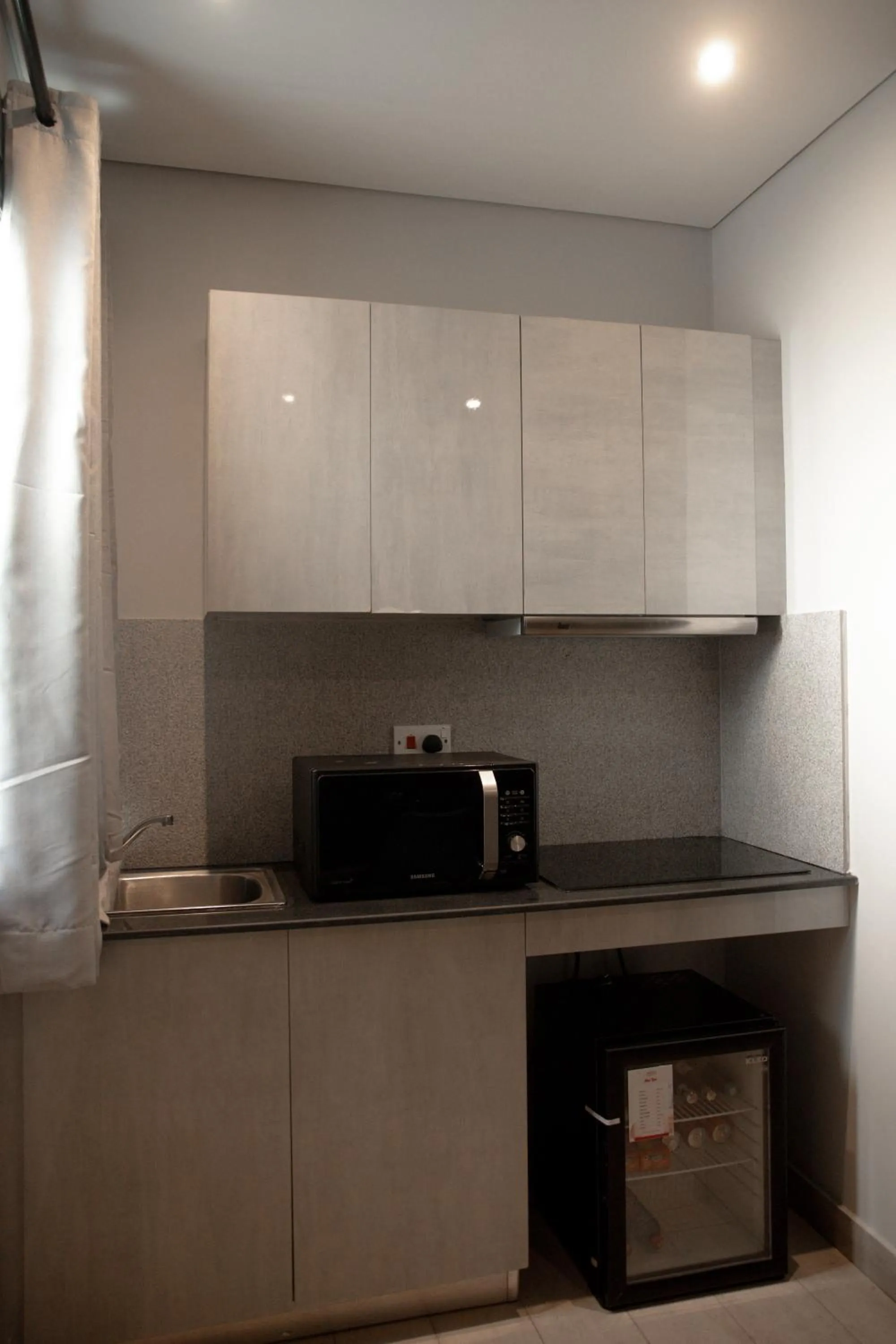 Kitchen or kitchenette in Urbano Hotel