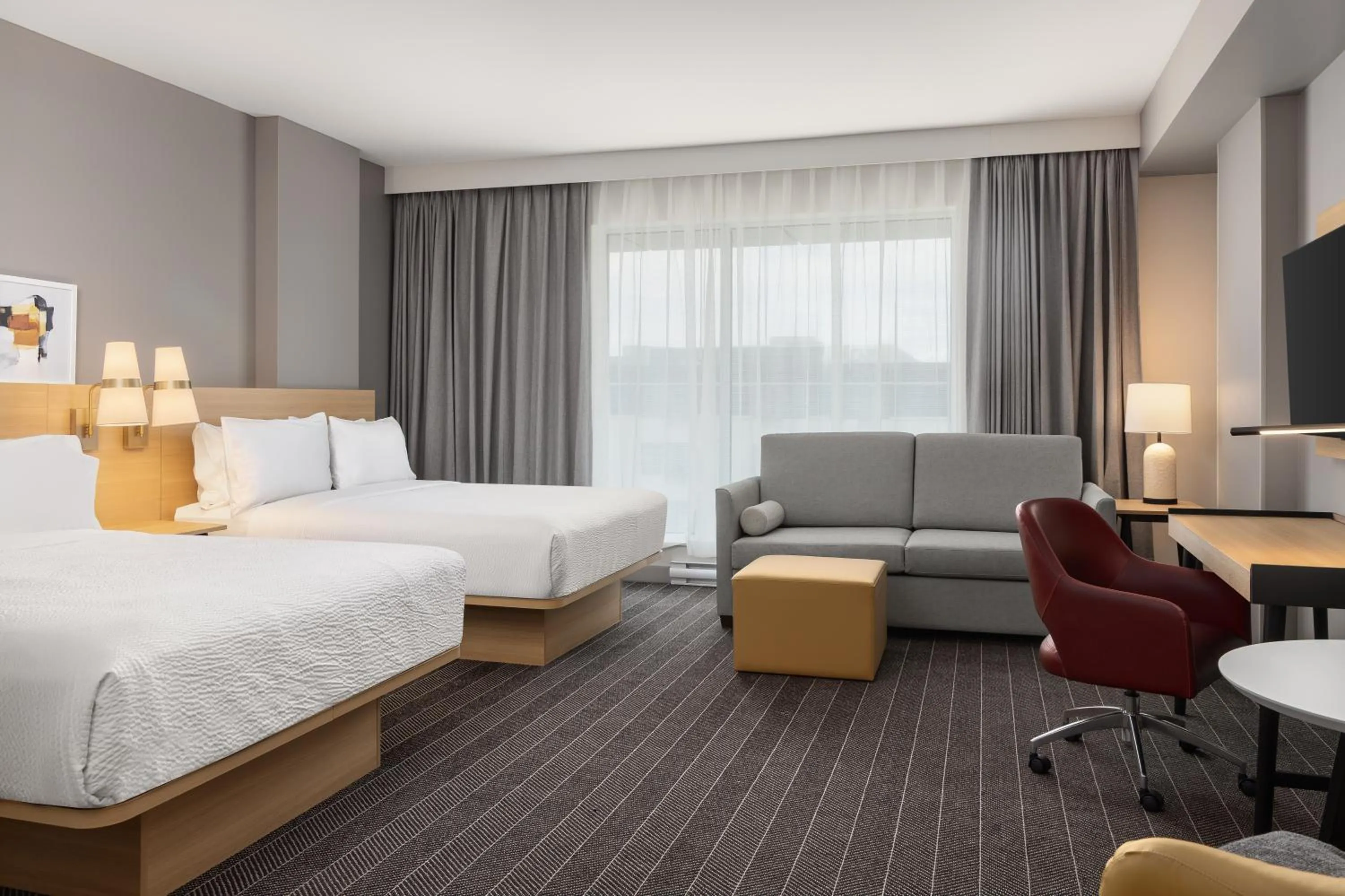 Bed in Staybridge Suites Montreal Airport - St-Laurent by IHG