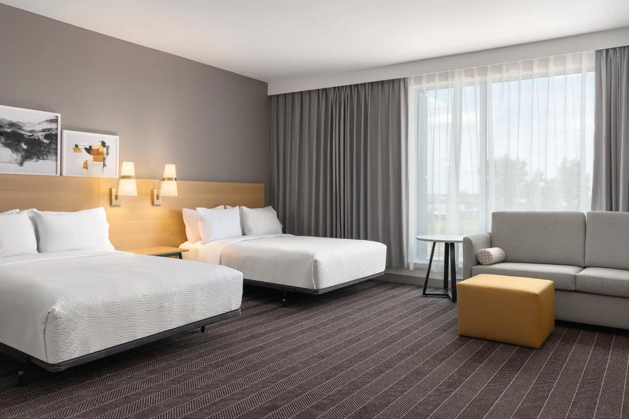 Photo of the whole room, Bed in Staybridge Suites Montreal Airport - St-Laurent by IHG