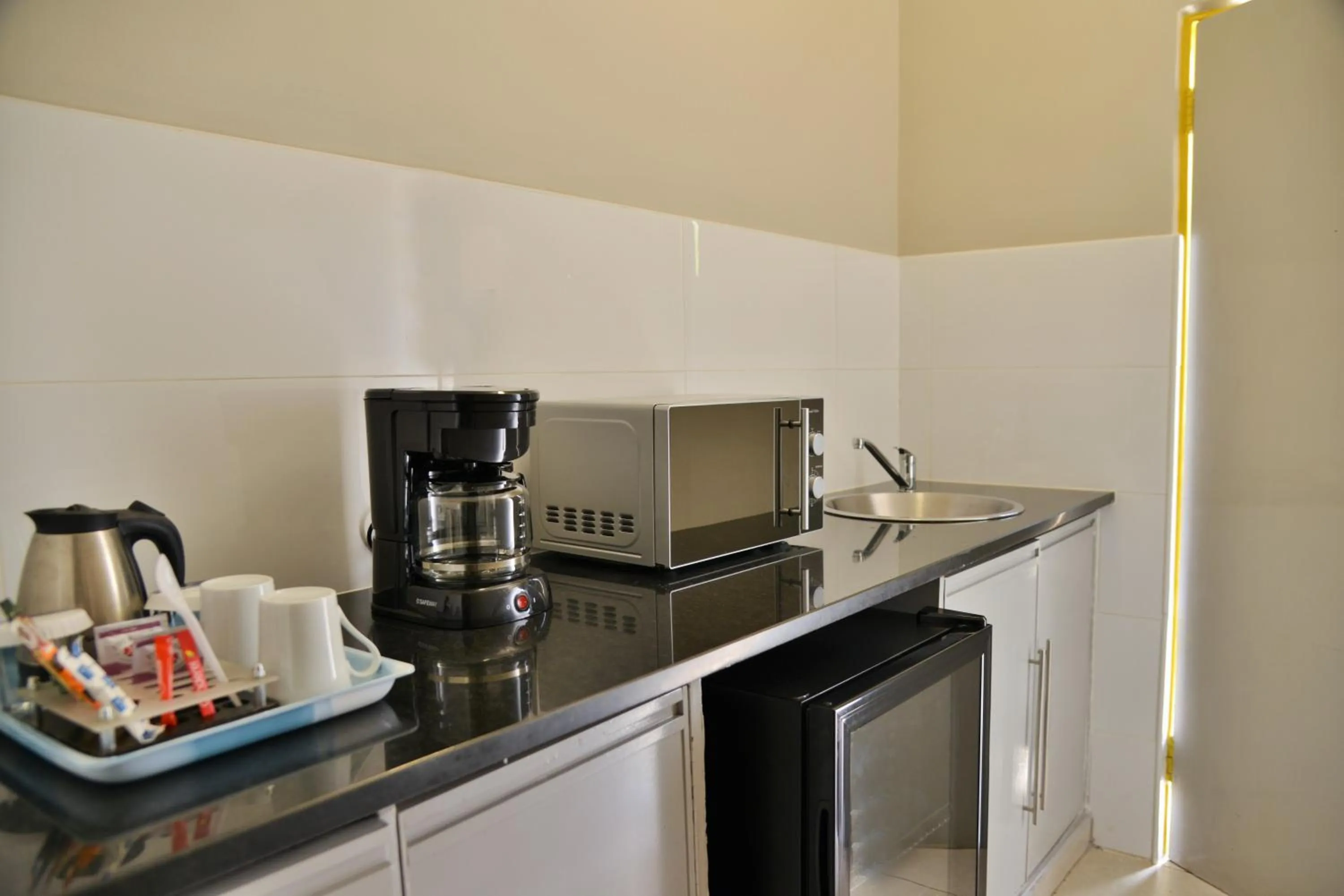 Kitchen or kitchenette in Cresta Oasis Hotel