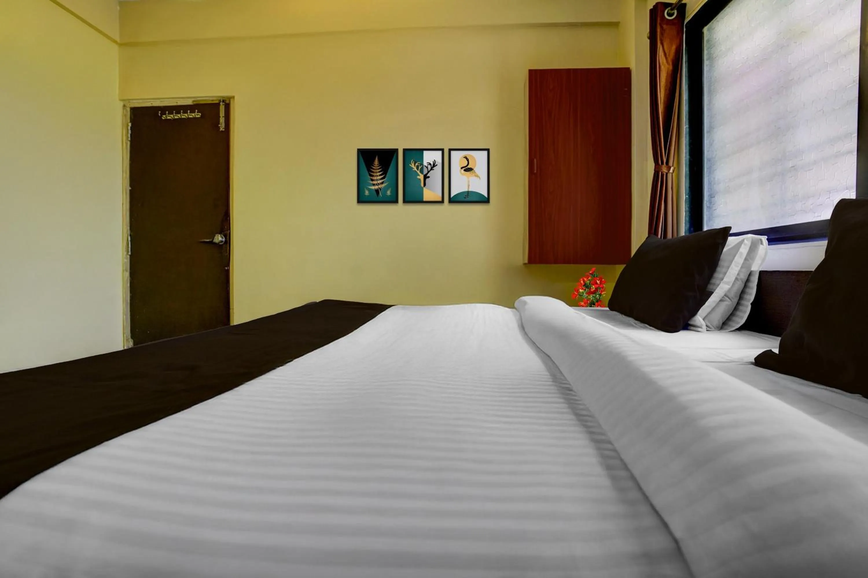 Bedroom, Bed in Super Hotel O Sainagar Shirdi Railway Junction Formerly Sai Vyankatesh Residency