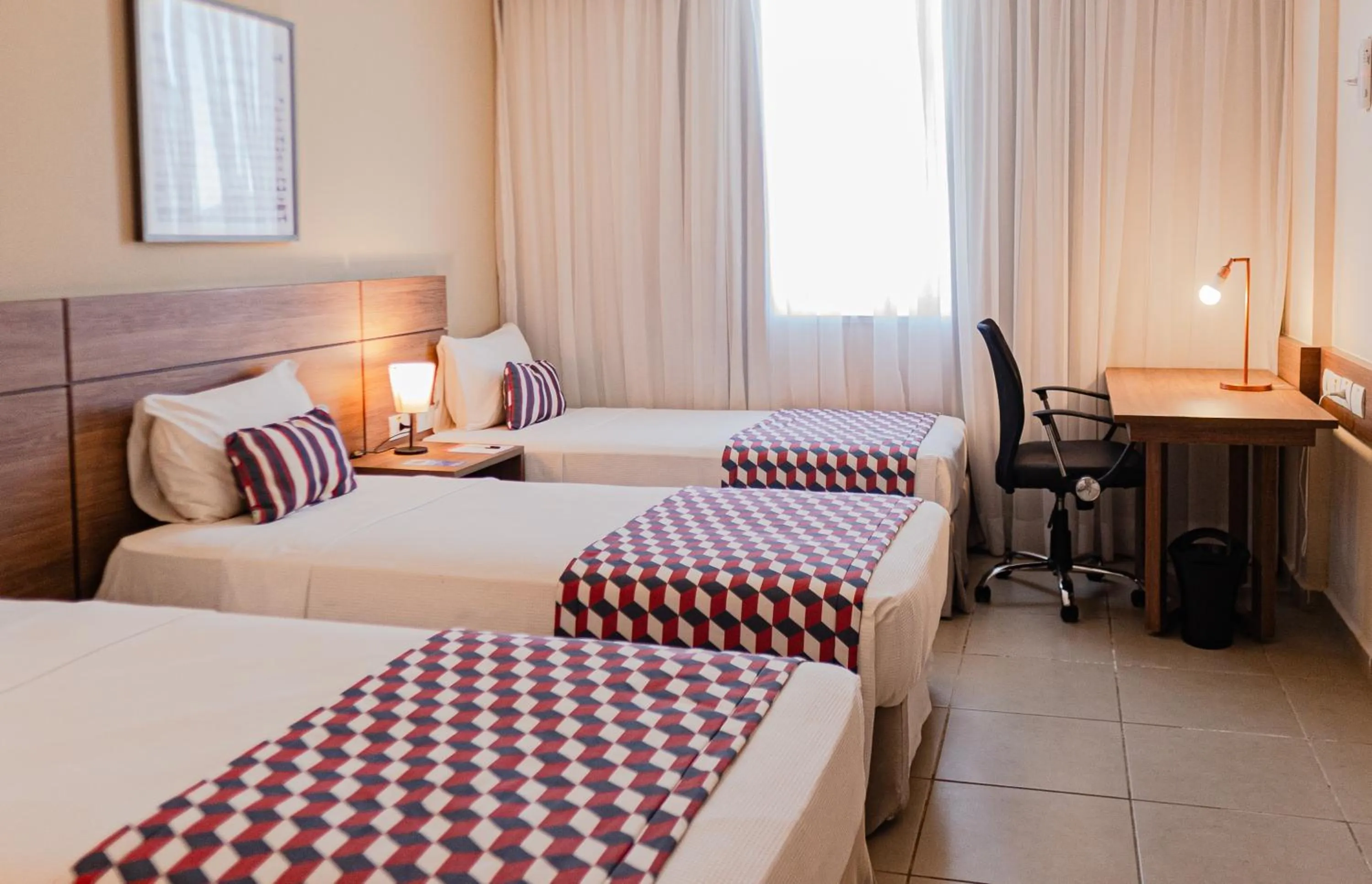 Property building, Bed in Tulip Inn Campos dos Goytacazes