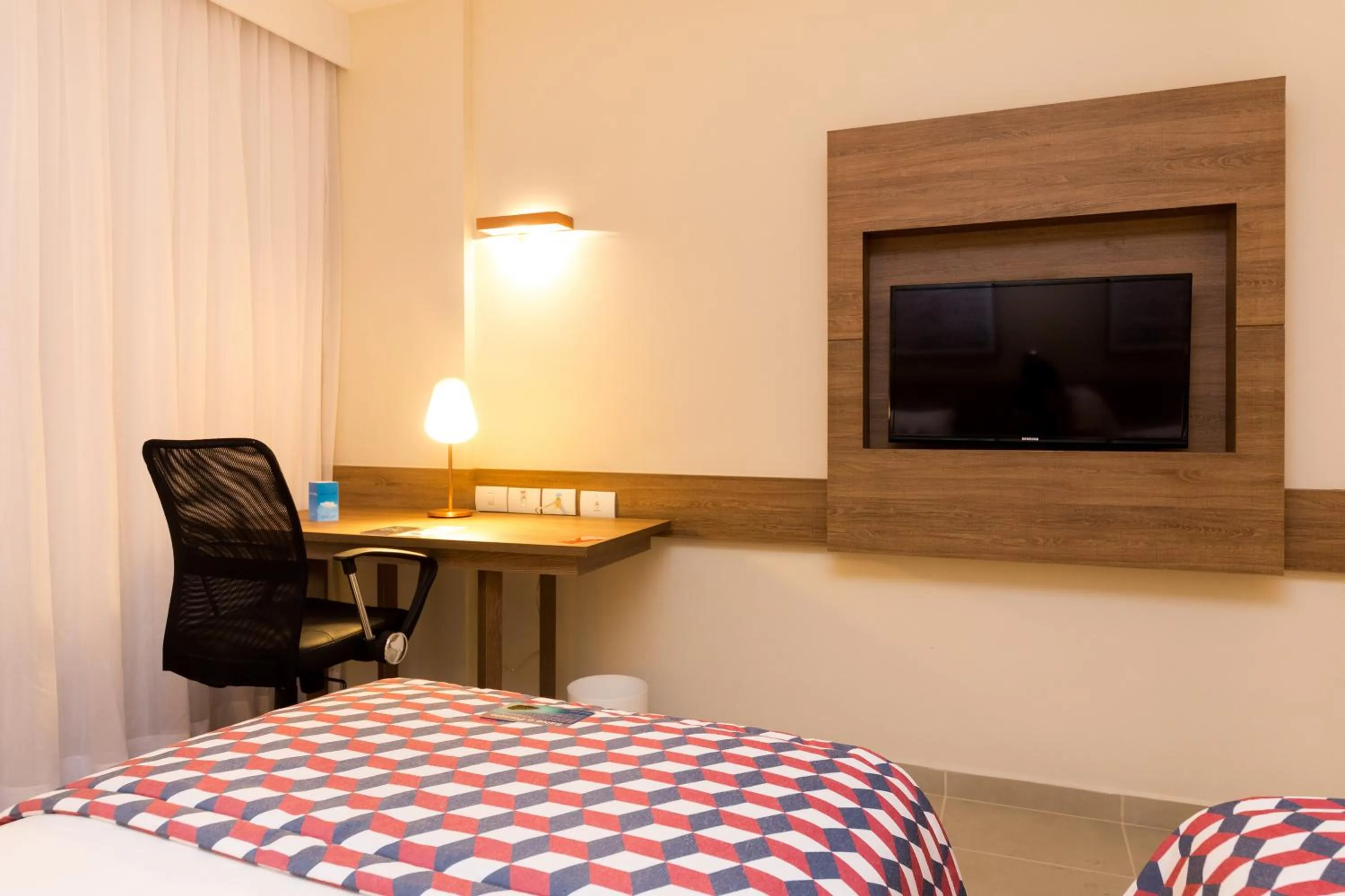 Decorative detail, Bed in Tulip Inn Campos dos Goytacazes