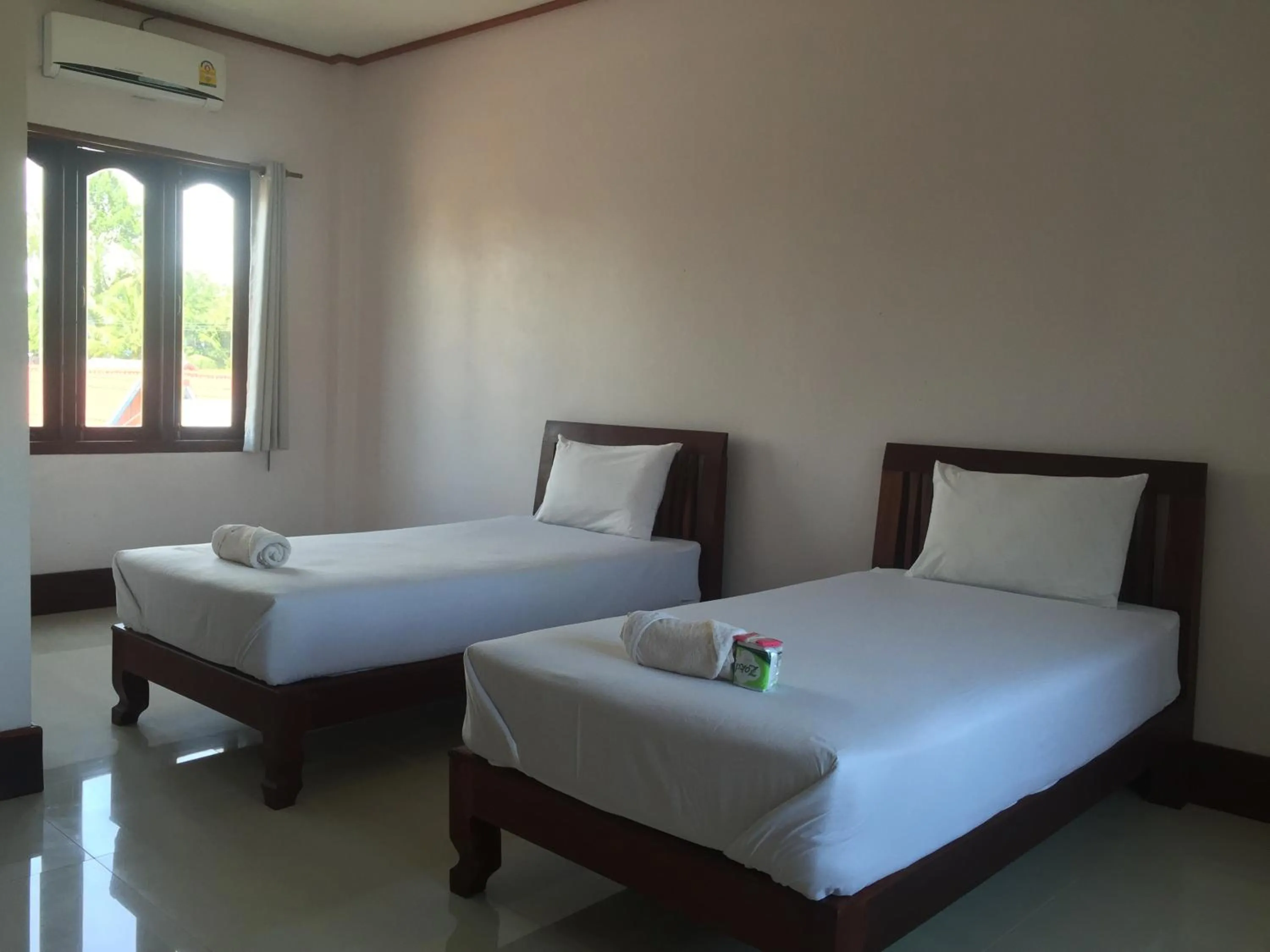 Bed in Mama Leurth Sunset Guesthouse