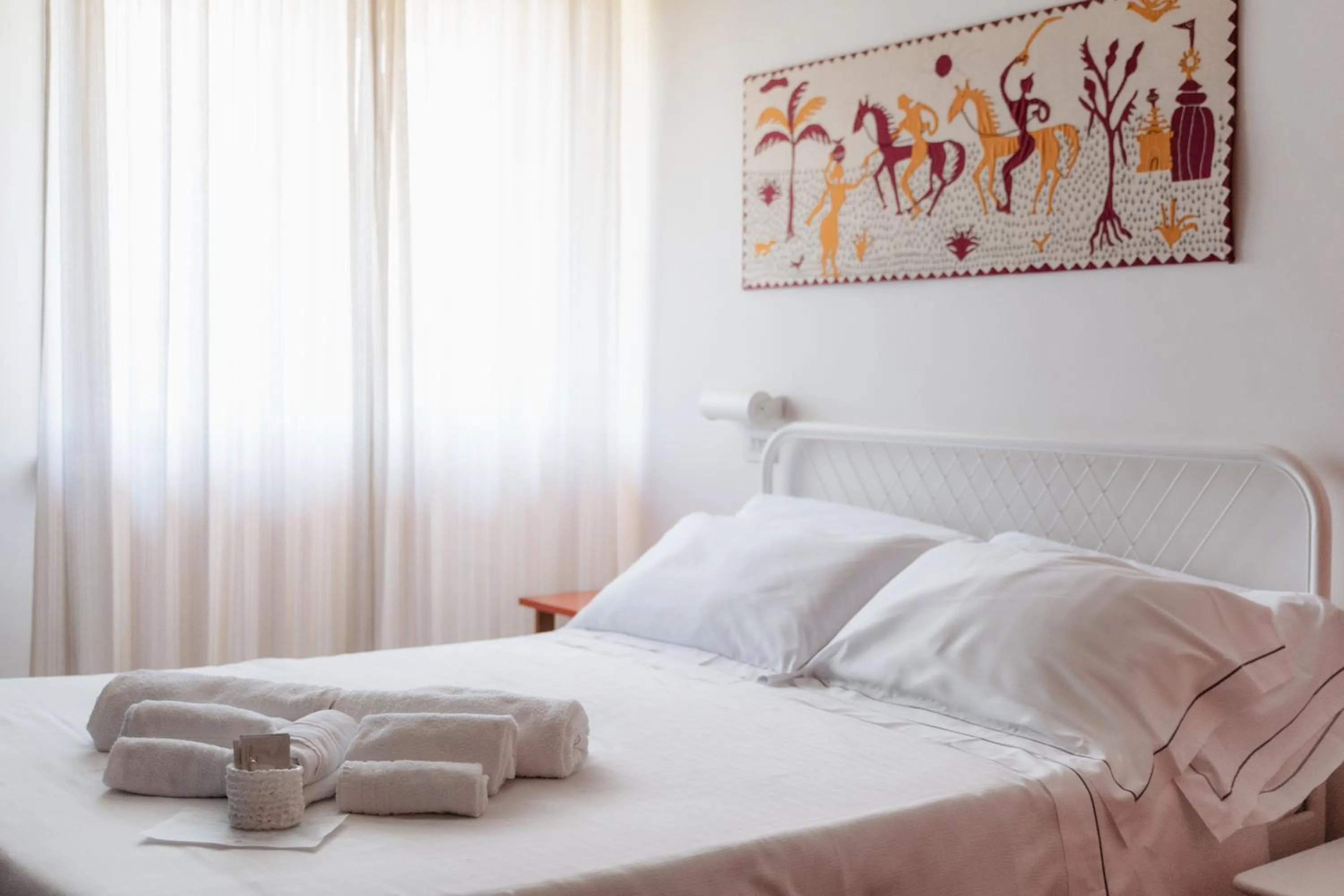 Bed in Mami Sabaudia Hotel