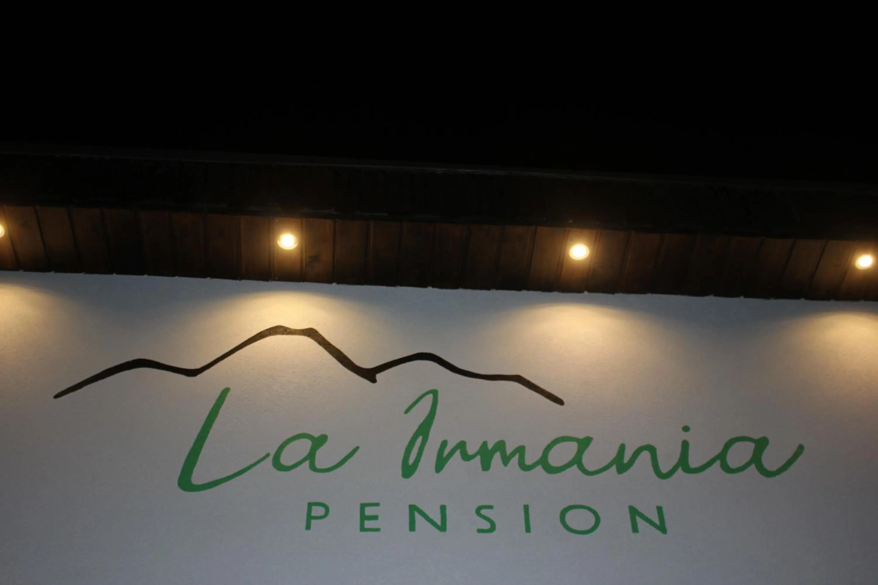 Property logo or sign in La Irmania Pension