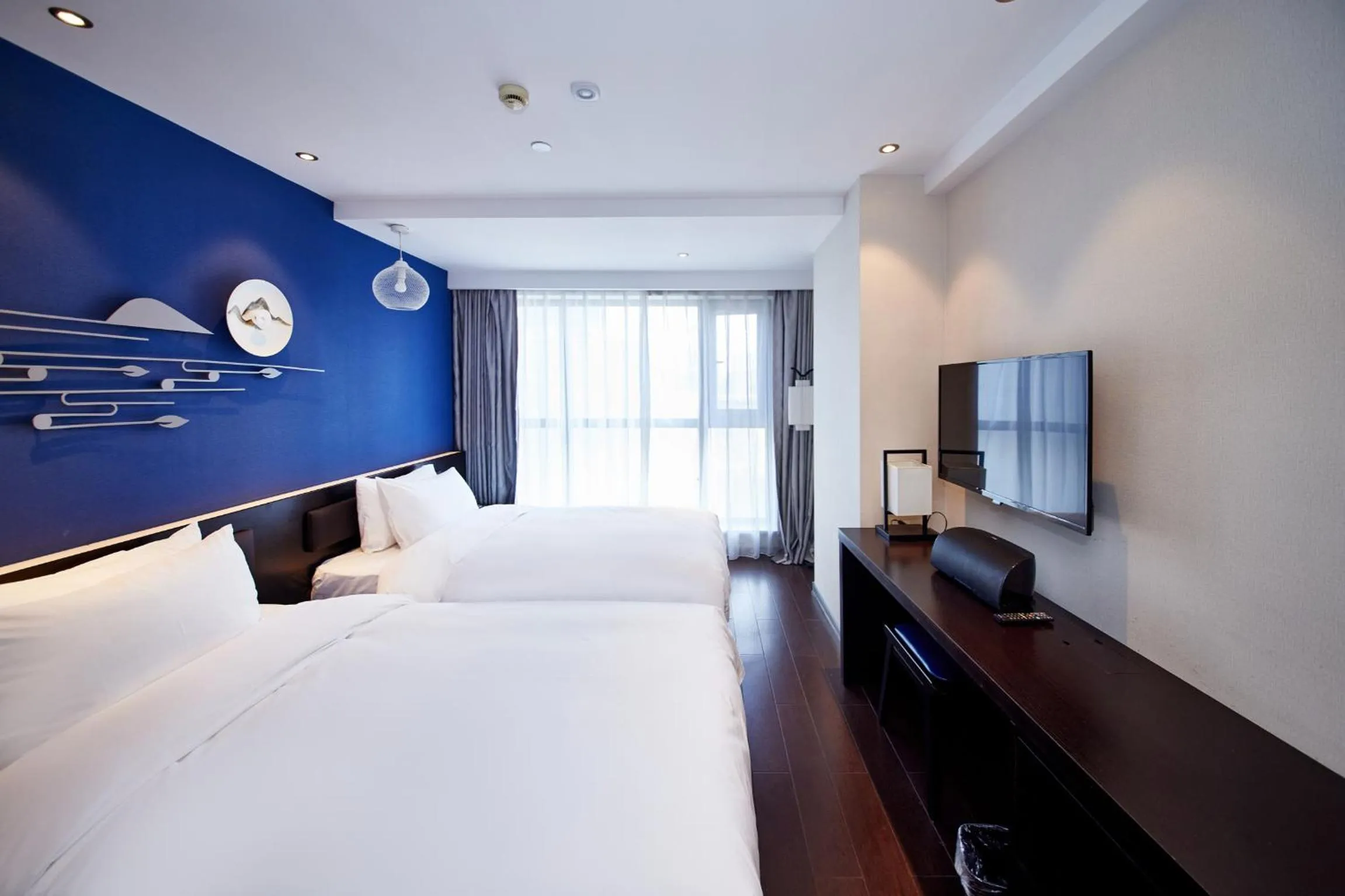 Bedroom, Bed in Orange Hotel Shanghai Hongkou Football Stadium Branch