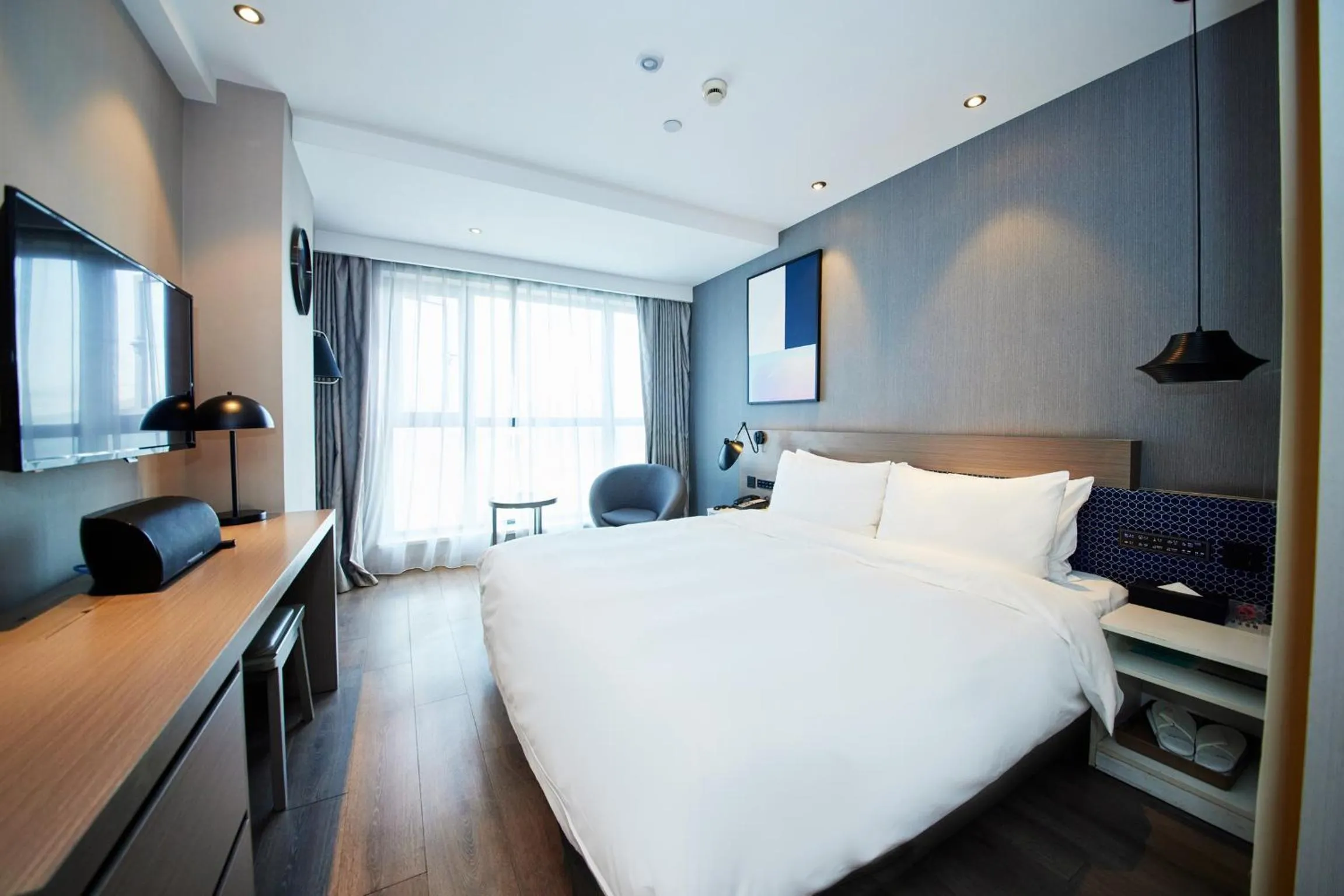Bedroom, Bed in Orange Hotel Shanghai Hongkou Football Stadium Branch